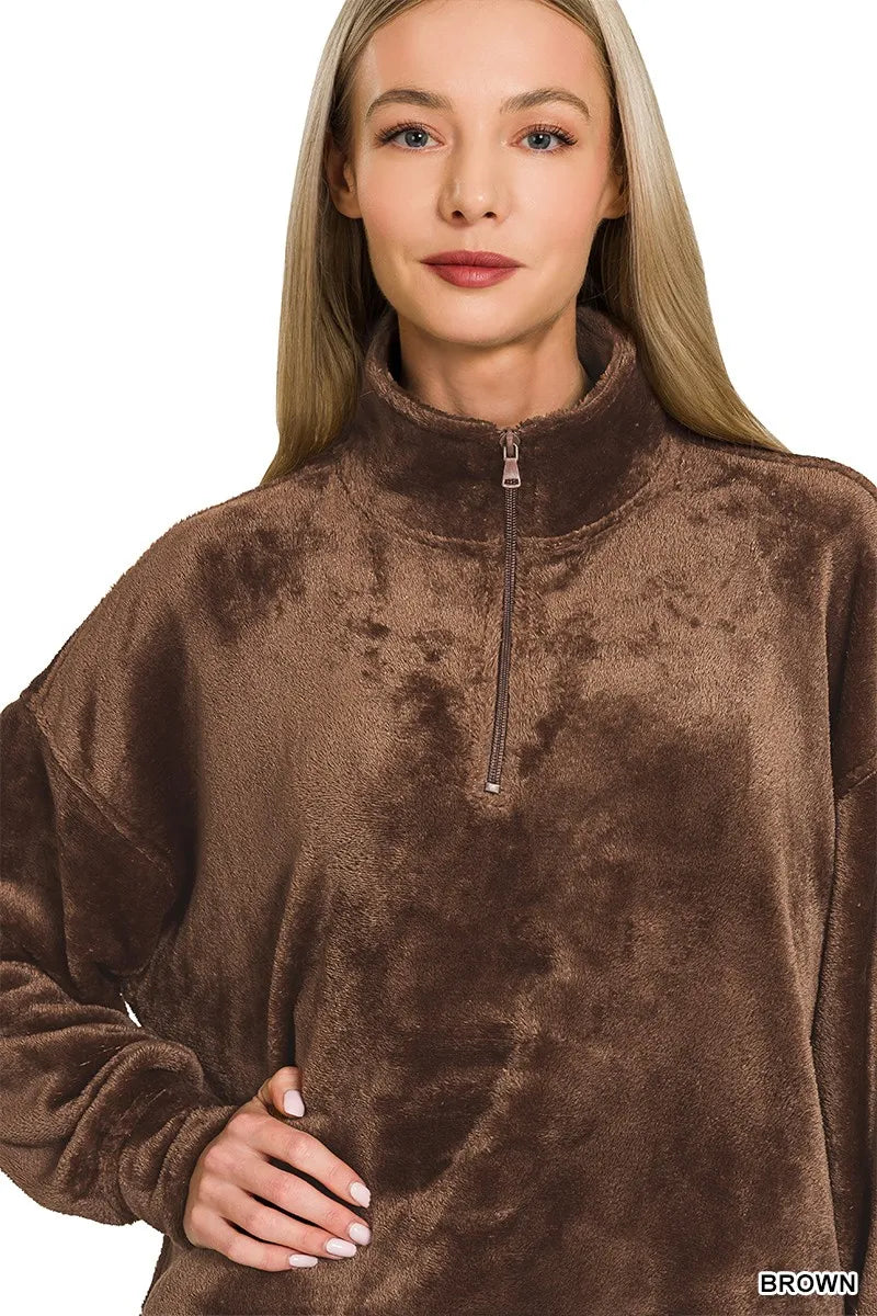 Model wearing brown Zenana Cozy Luxe faux fur half zip pullover with pockets.