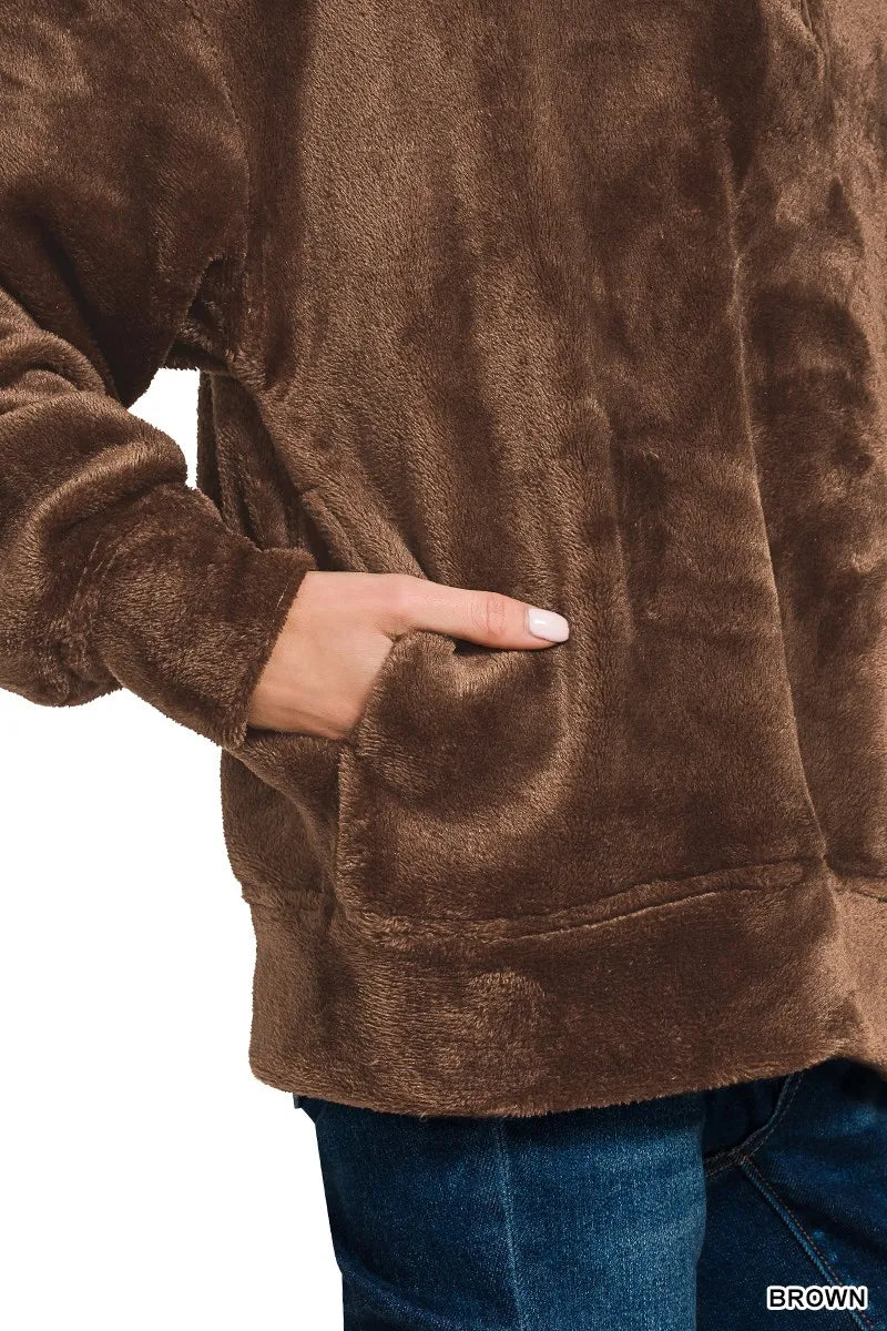 Model wearing brown Zenana Cozy Luxe faux fur half zip pullover with pockets.