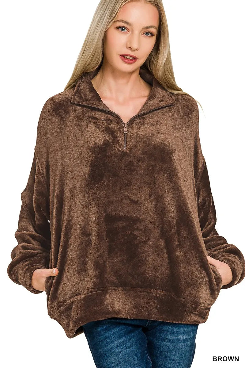 Model wearing brown Zenana Cozy Luxe faux fur half zip pullover with pockets.