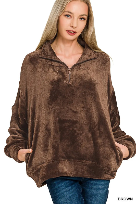 Model wearing brown Zenana Cozy Luxe faux fur half zip pullover with pockets.