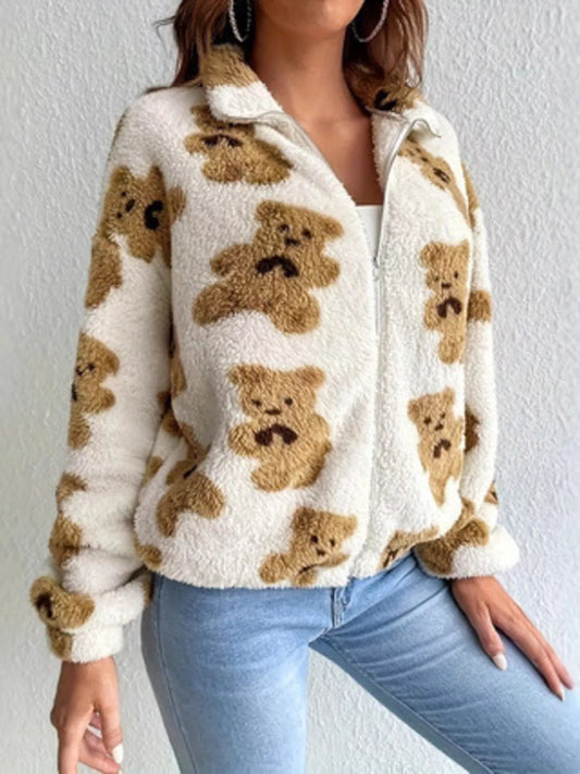 Plush teddy zip-up jacket with bear pattern styled with denim jeans