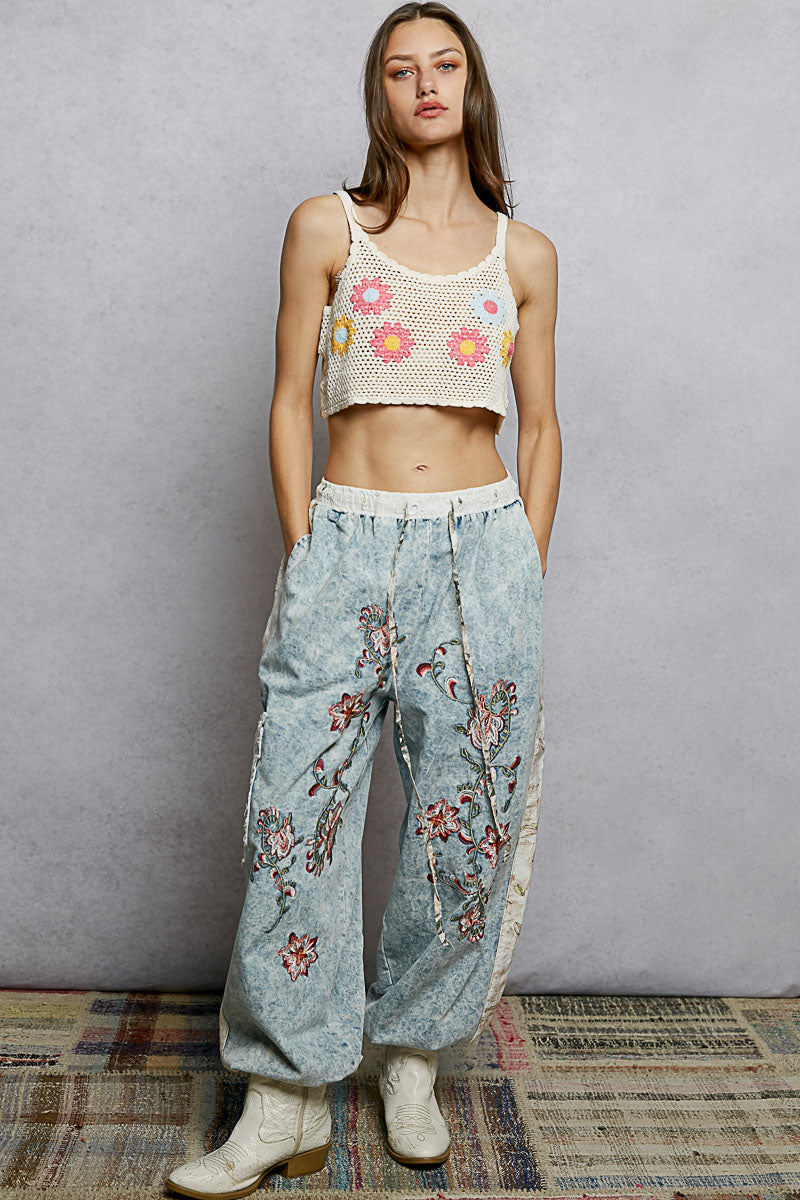 Cream crochet crop top with colorful embroidered flowers