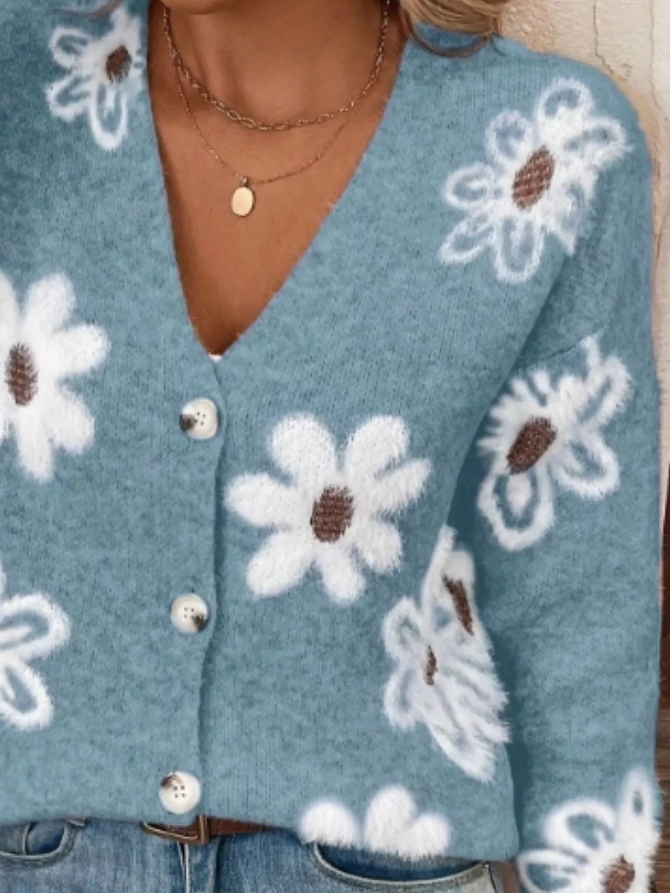 Blue button-front cardigan with white daisy print styled with jeans