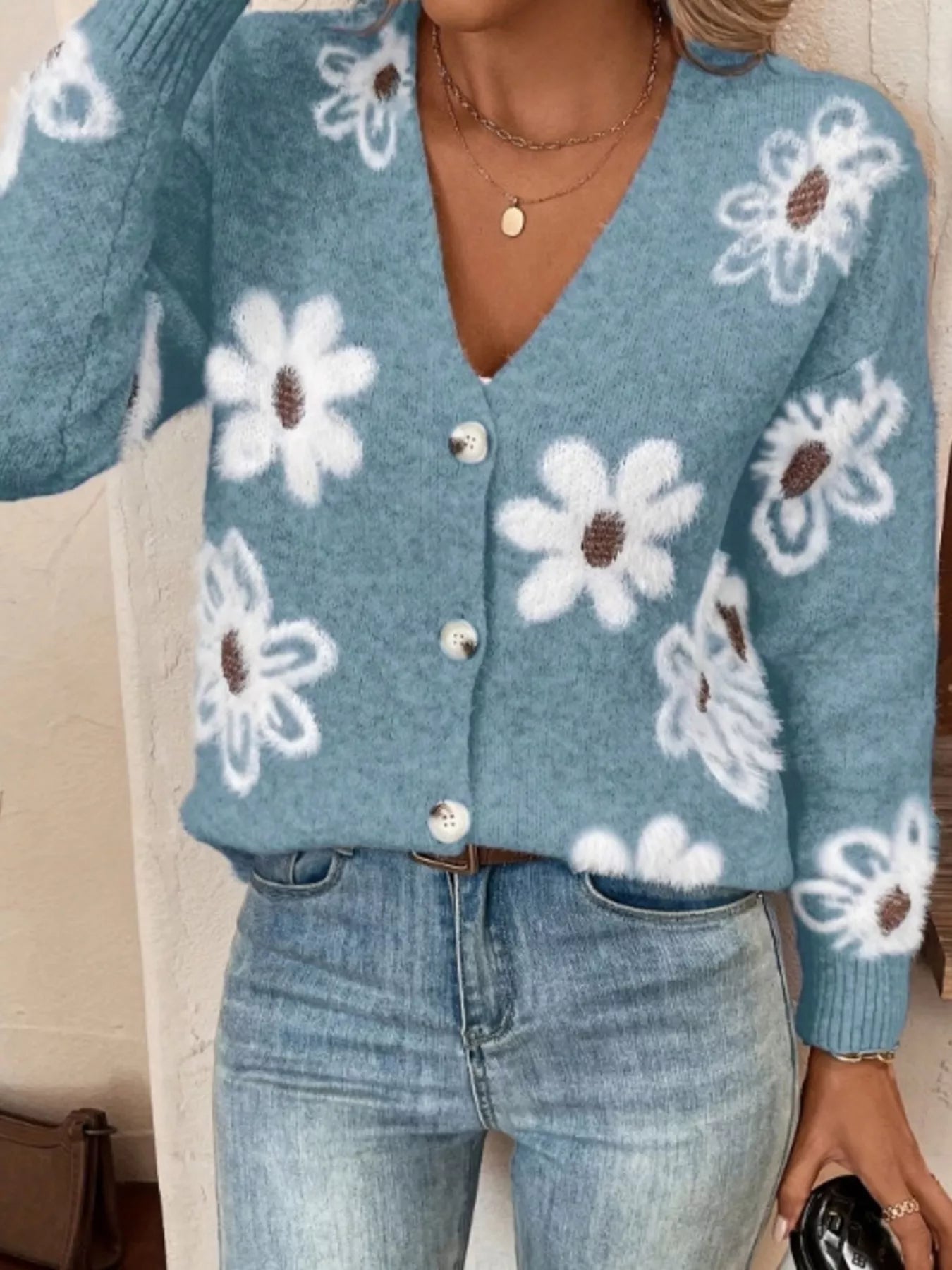 Blue button-front cardigan with white daisy print styled with jeans