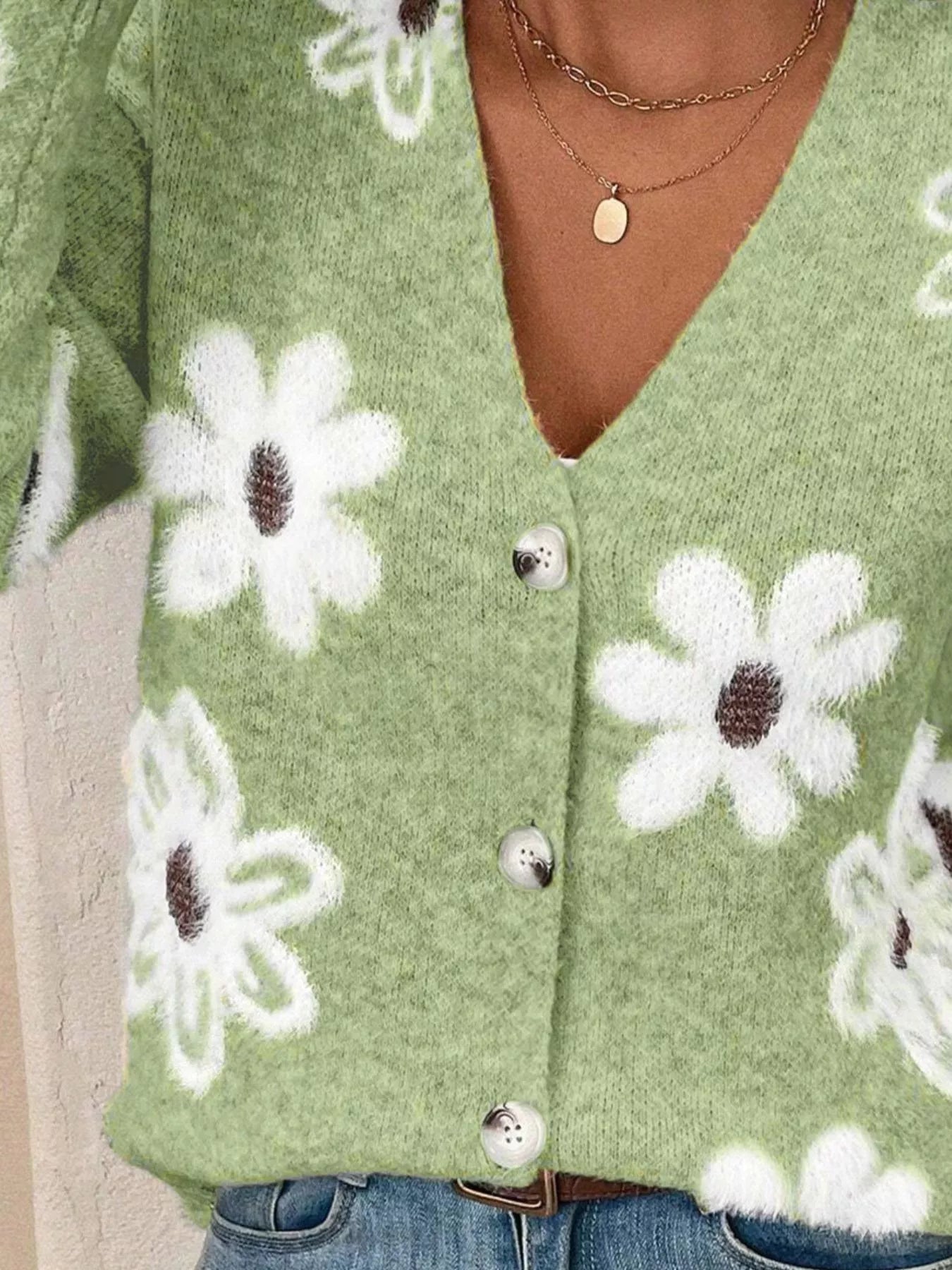 Green button-front cardigan with white daisy print styled with jeans