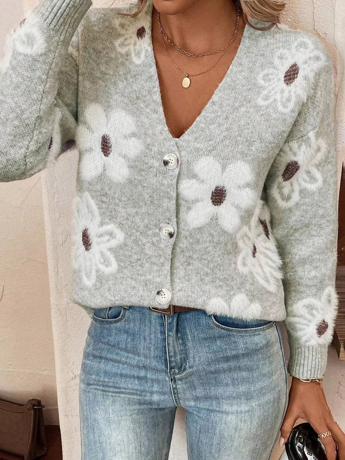 Grey button-front cardigan with white daisy print styled with jeans