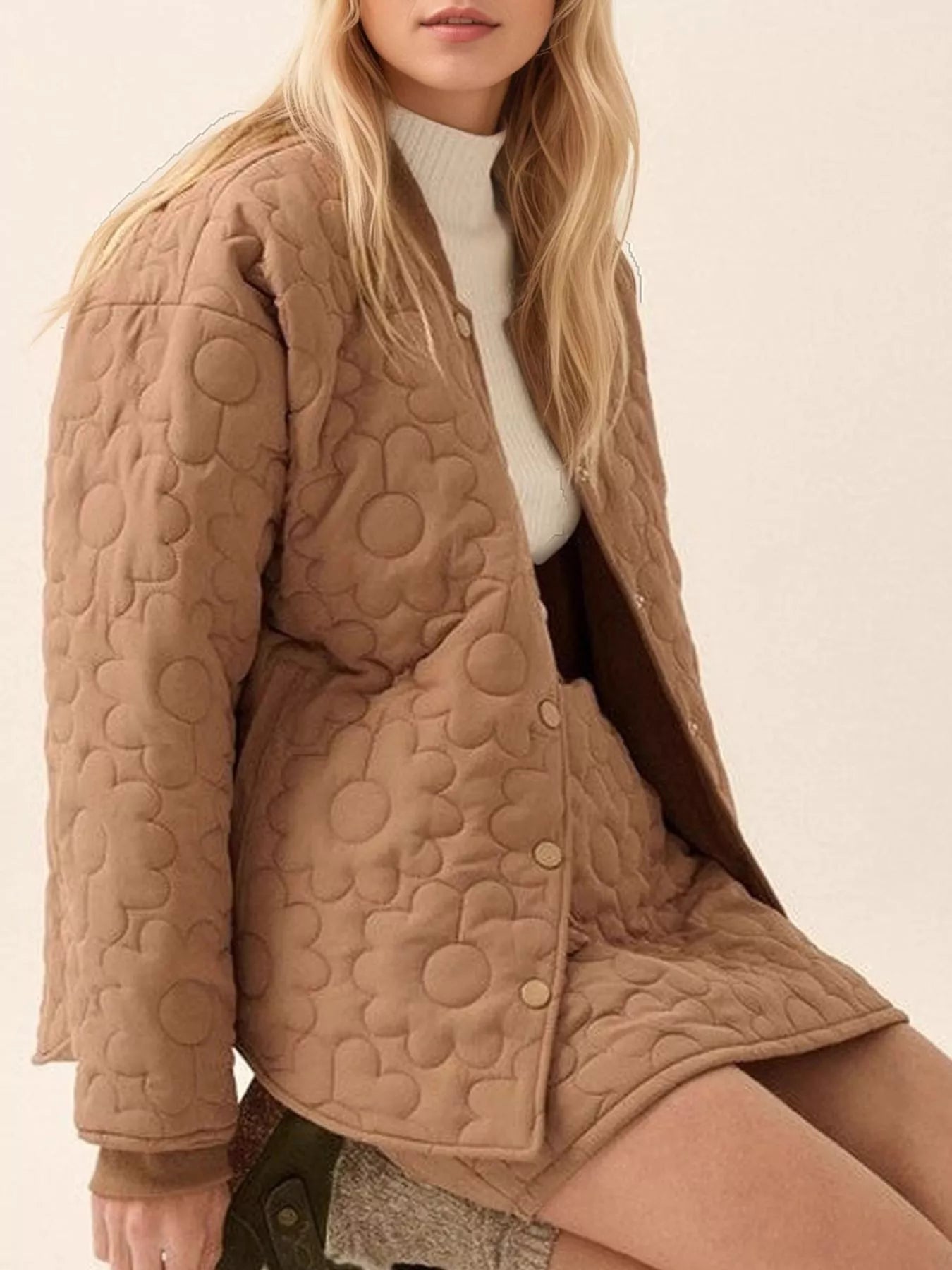 Daisy Dreams Quilted Snap Jacket in brown with daisy quilted floral design and snap closure.