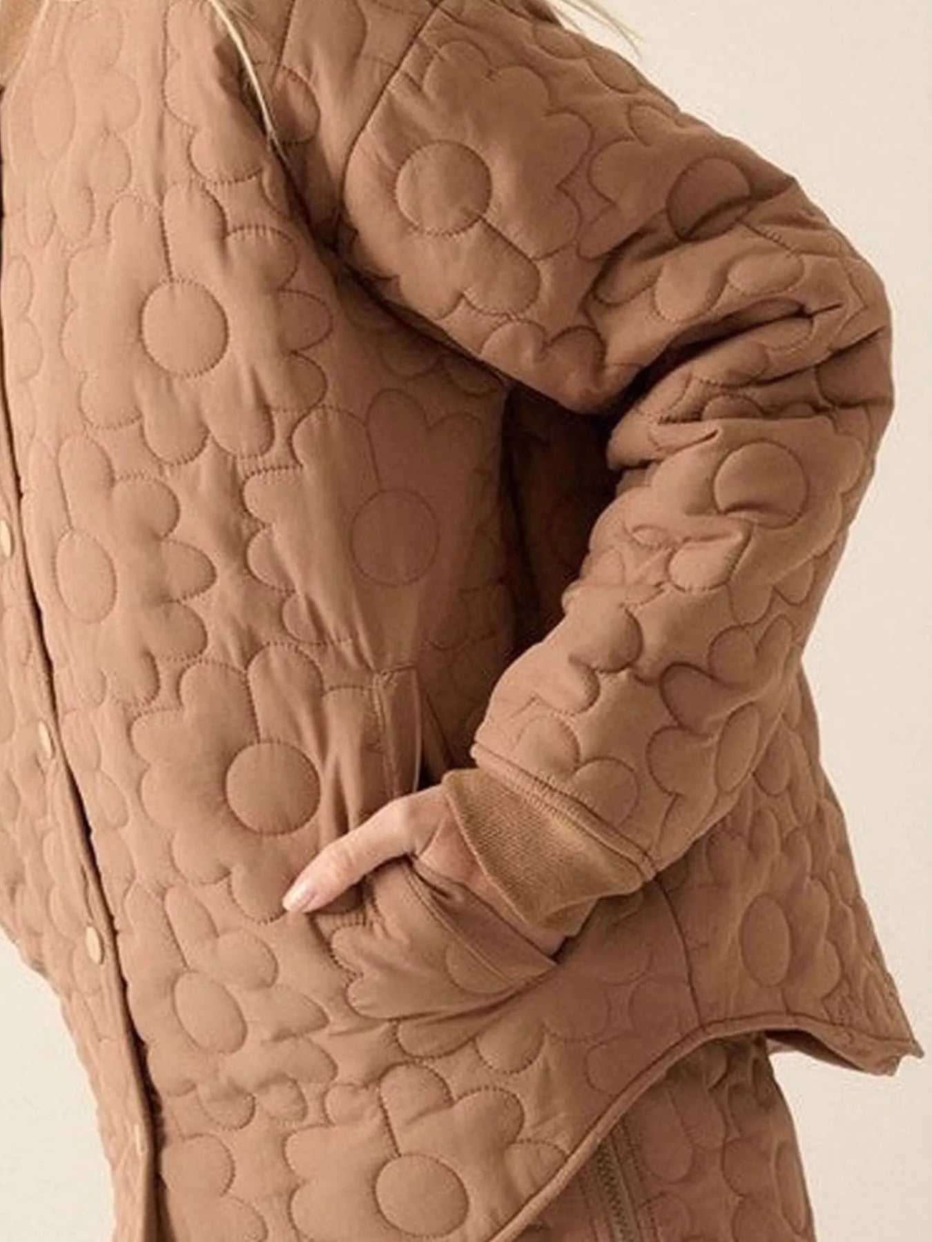 Daisy Dreams Quilted Snap Jacket in brown with daisy quilted floral design and snap closure.