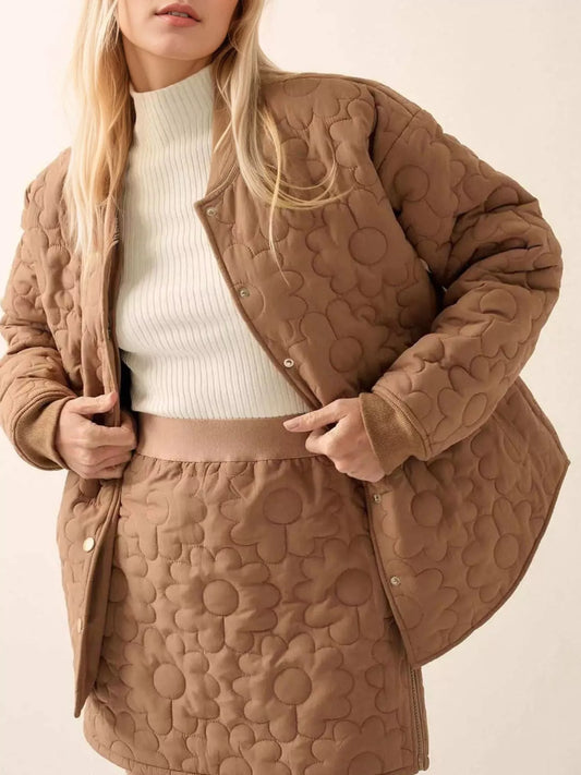 Daisy Dreams Quilted Snap Jacket in brown with daisy quilted floral design and snap closure.