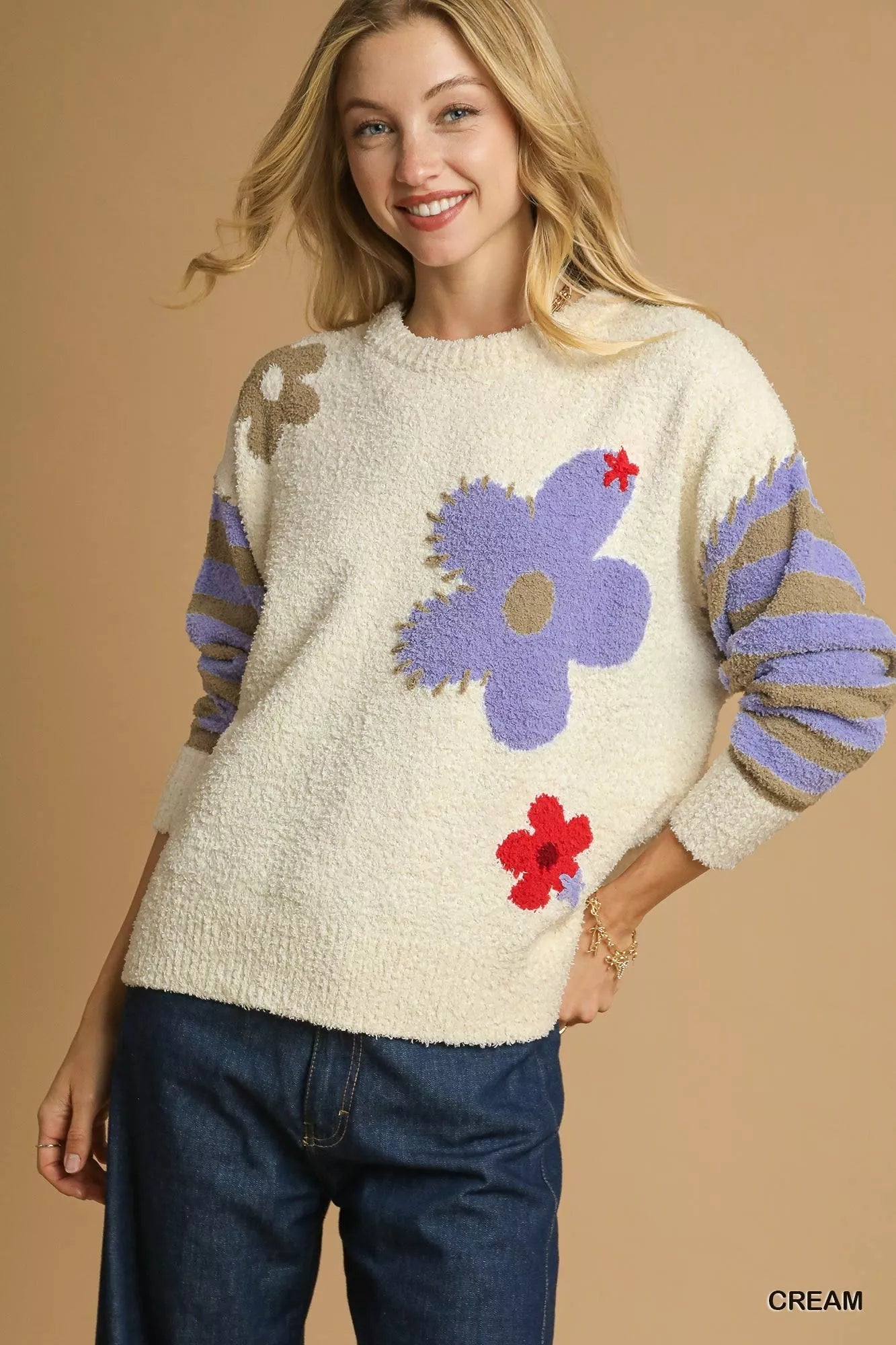 Daisy Dreams Sweater with oversized jacquard floral design and striped sleeves in cream and purple