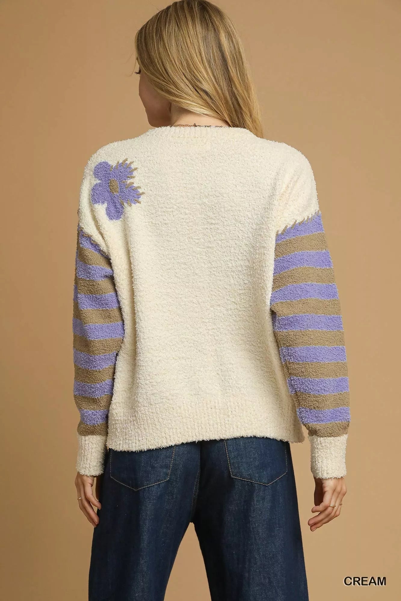 Daisy Dreams Sweater with oversized jacquard floral design and striped sleeves in cream and purple