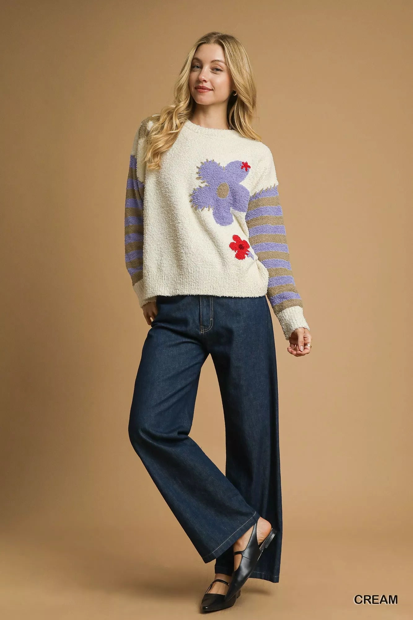Daisy Dreams Sweater with oversized jacquard floral design and striped sleeves in cream and purple