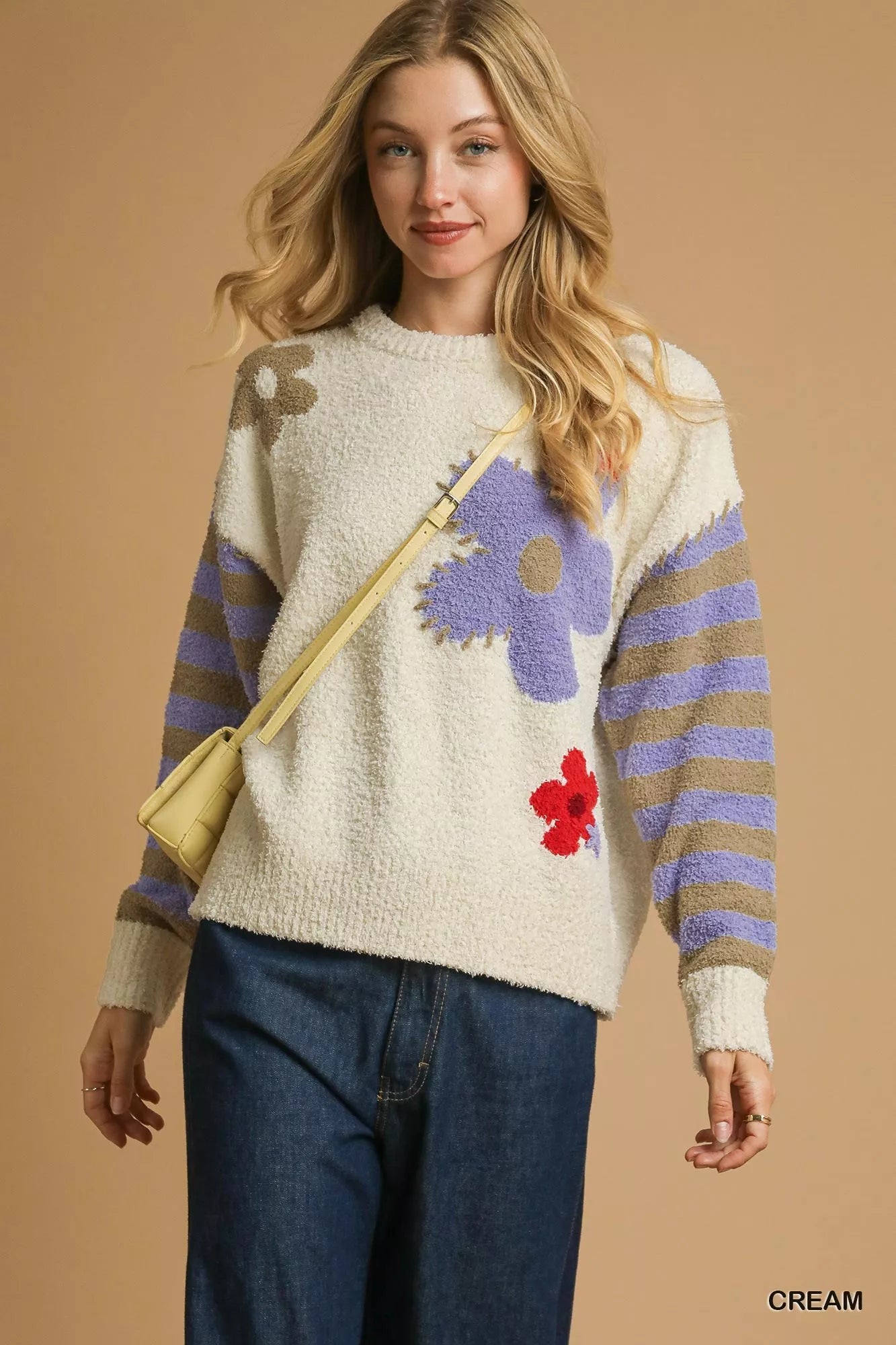 Daisy Dreams Sweater with oversized jacquard floral design and striped sleeves in cream and purple