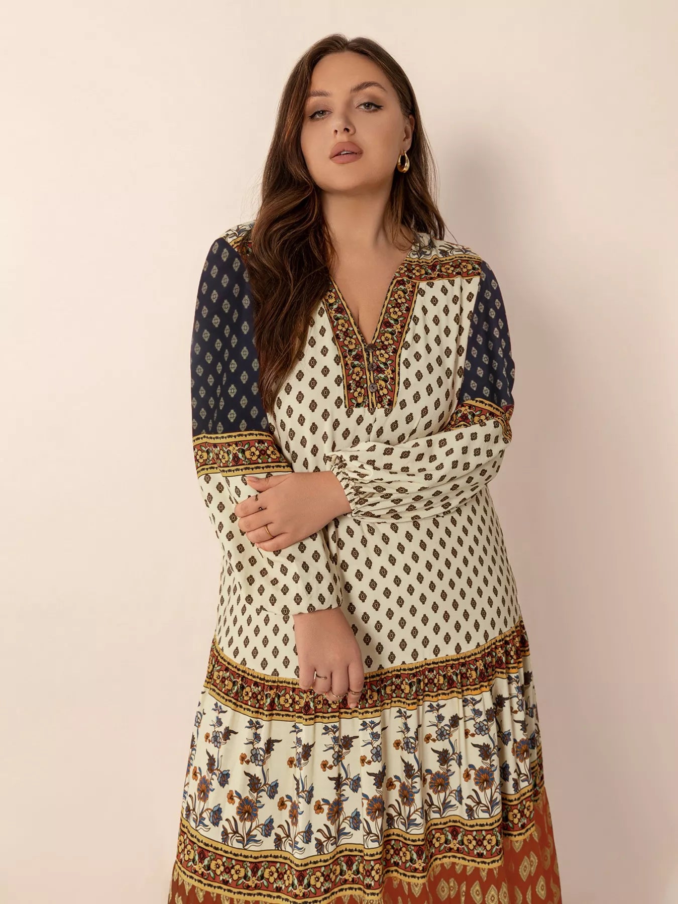 Plus size boho patchwork maxi dress with diamond print, floral panels, and ruched button detail