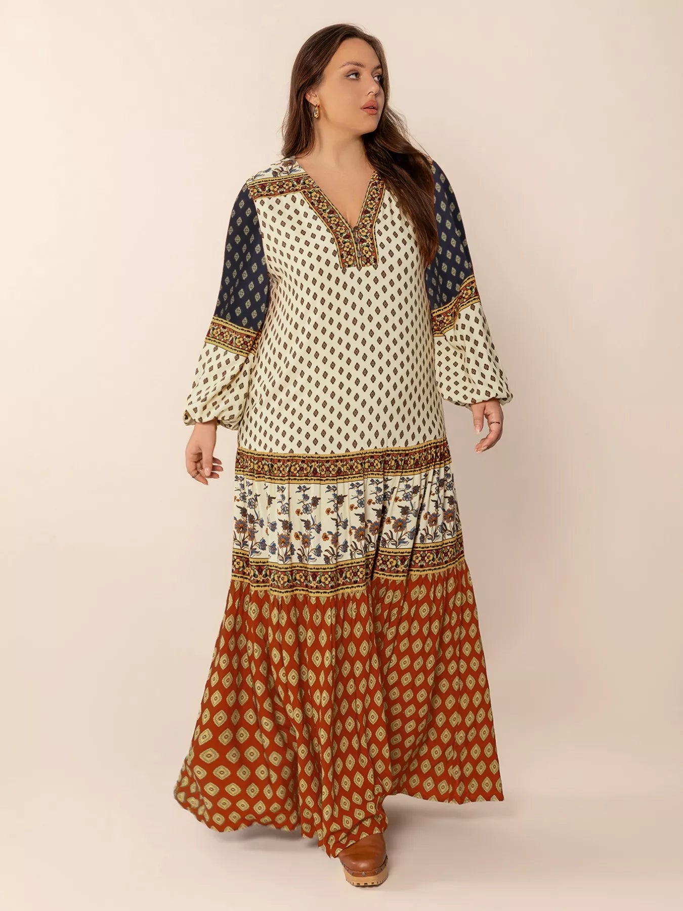 Plus size boho patchwork maxi dress with diamond print, floral panels, and ruched button detail