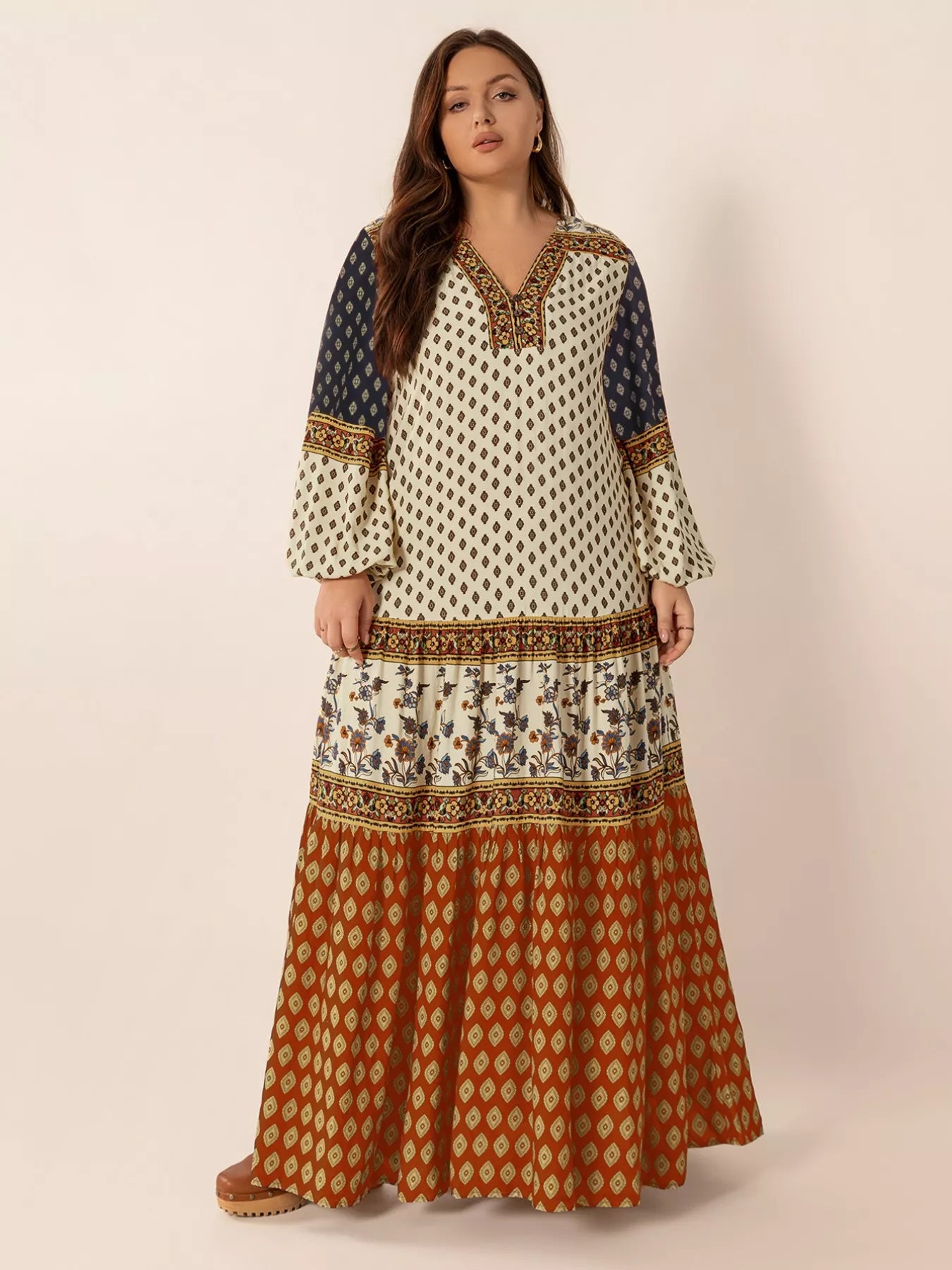 Plus size boho patchwork maxi dress with diamond print, floral panels, and ruched button detail