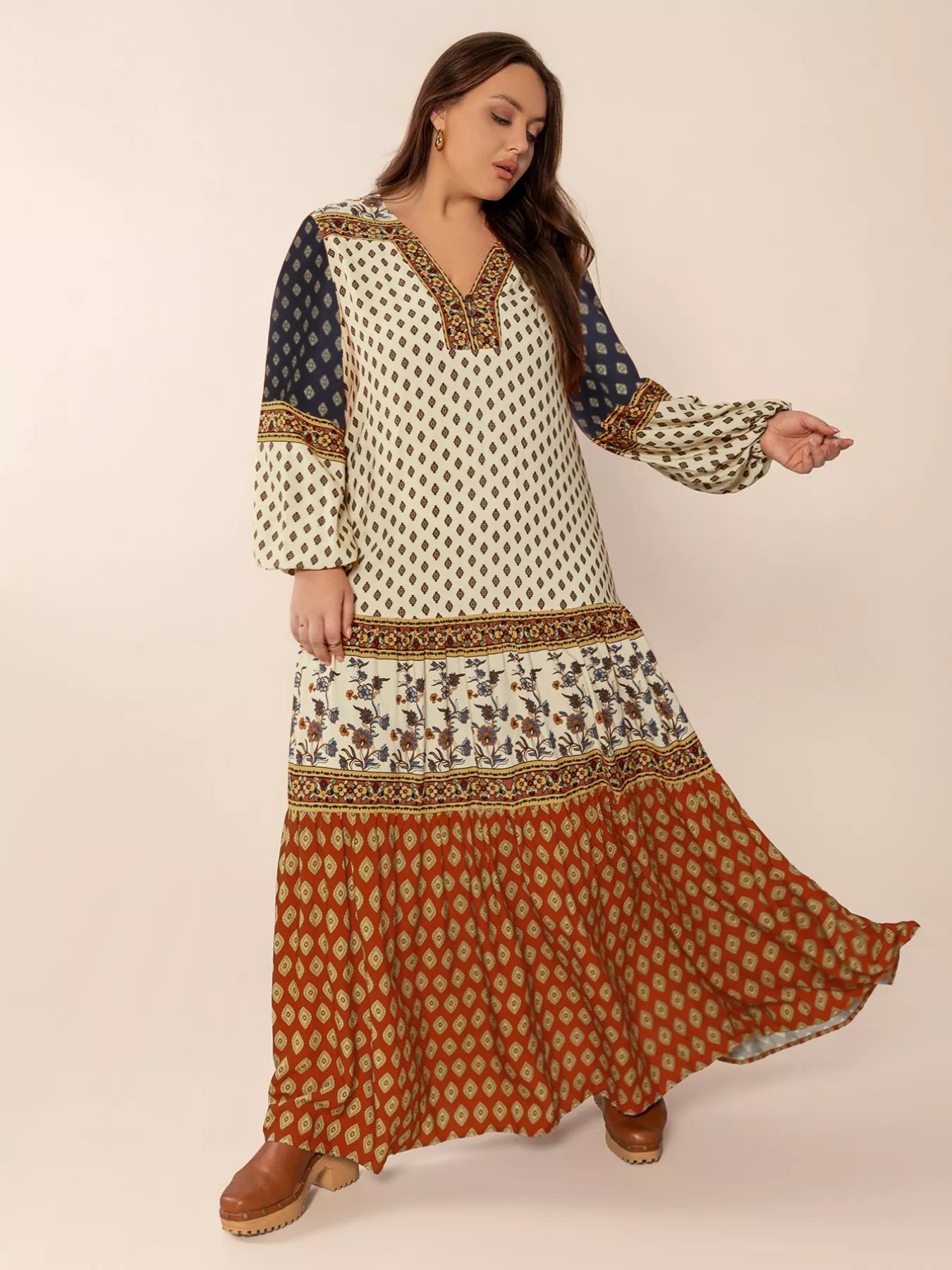 Plus size boho patchwork maxi dress with diamond print, floral panels, and ruched button detail