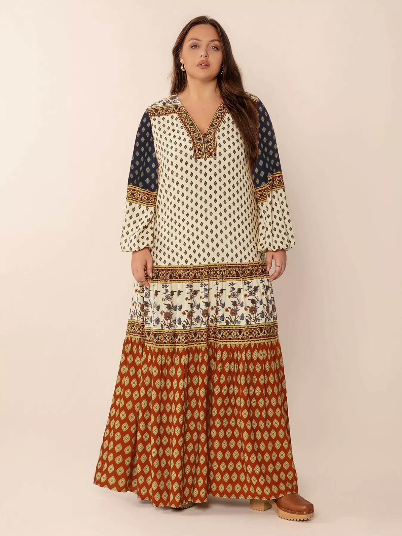 Plus size boho patchwork maxi dress with diamond print, floral panels, and ruched button detail