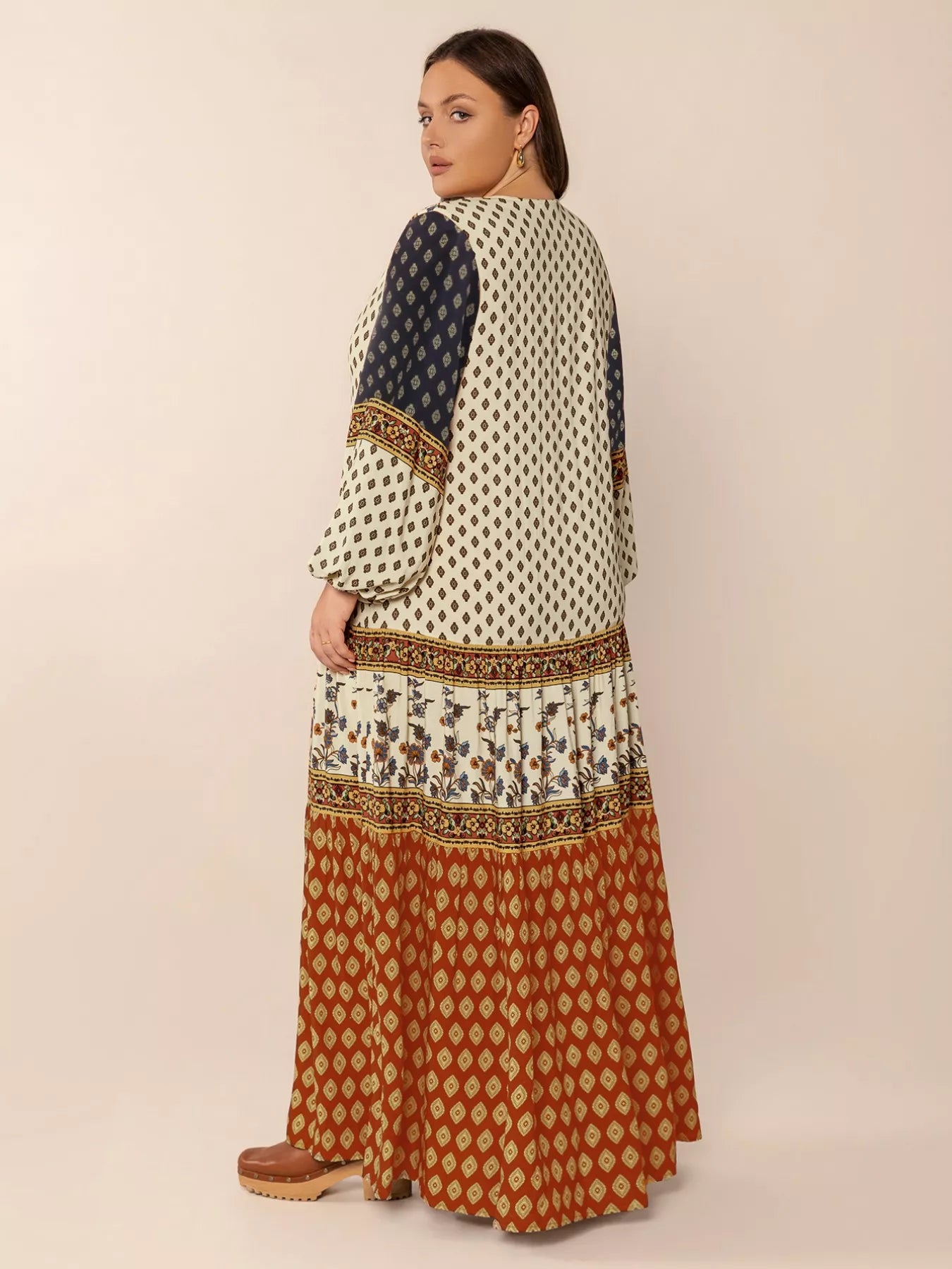 Plus size boho patchwork maxi dress with diamond print, floral panels, and ruched button detail