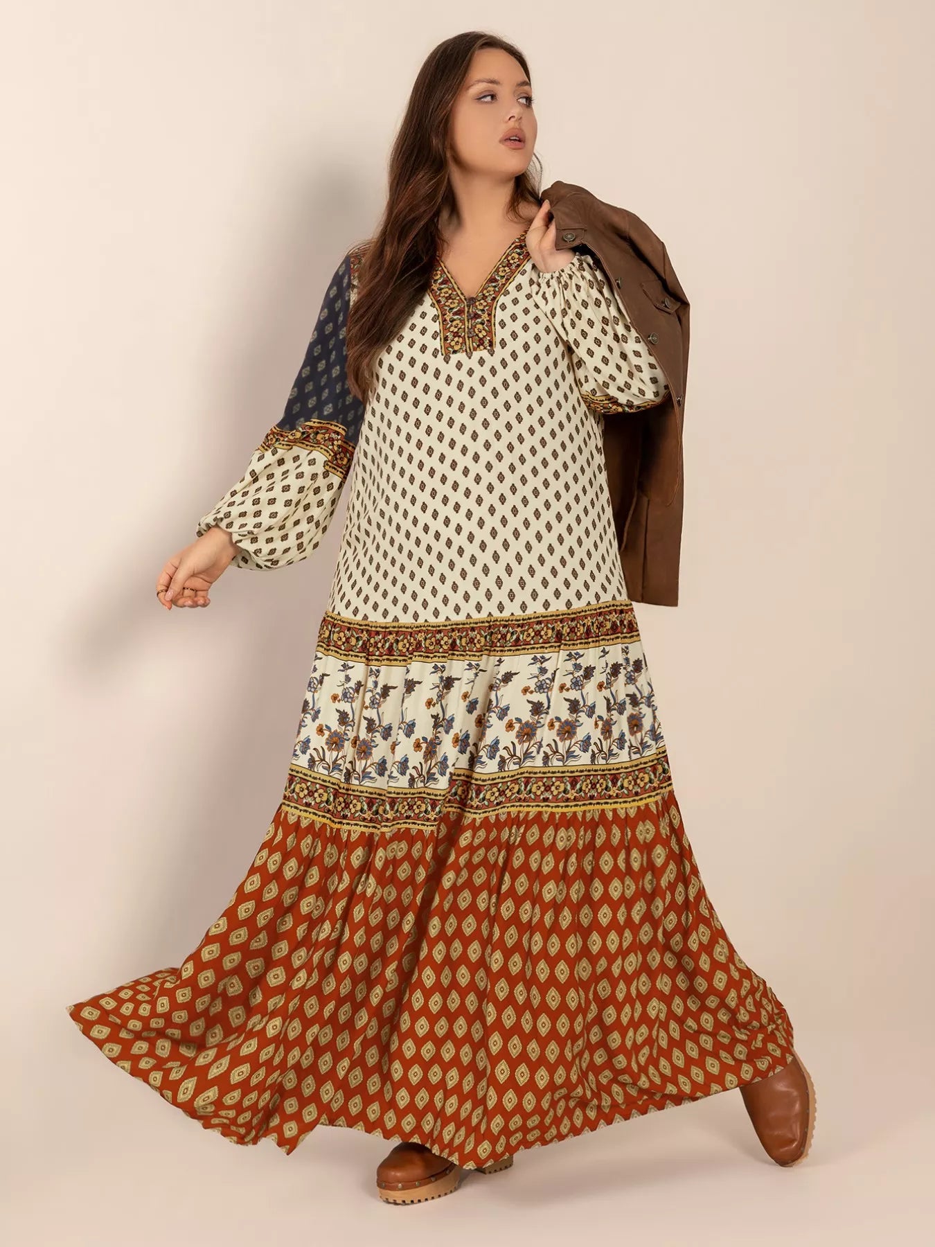 Plus size boho patchwork maxi dress with diamond print, floral panels, and ruched button detail