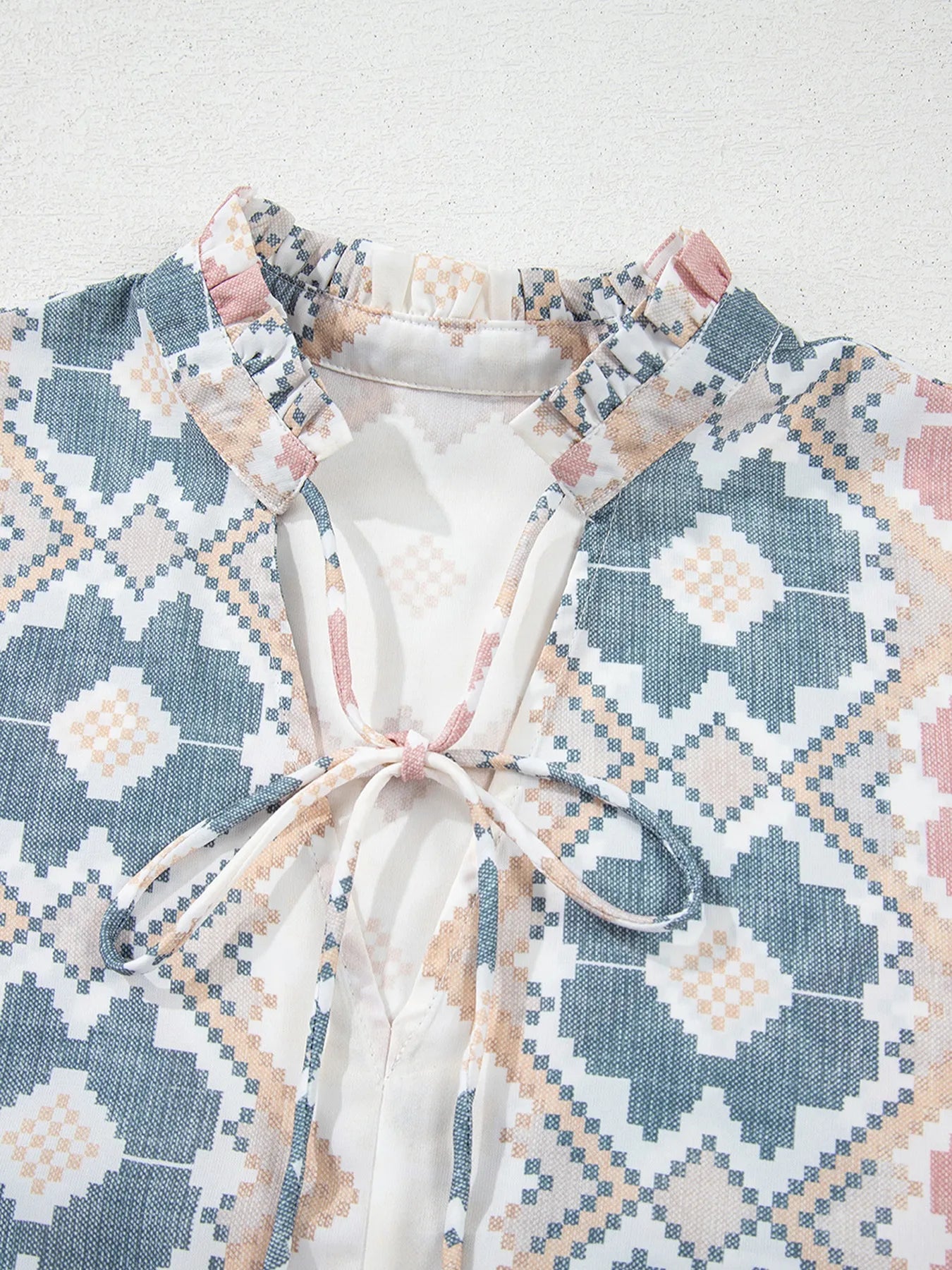 Bohemian geometric print blouse with frilled neckline and tassel tie – Desert Dunes style from A Whimsical Affair.
