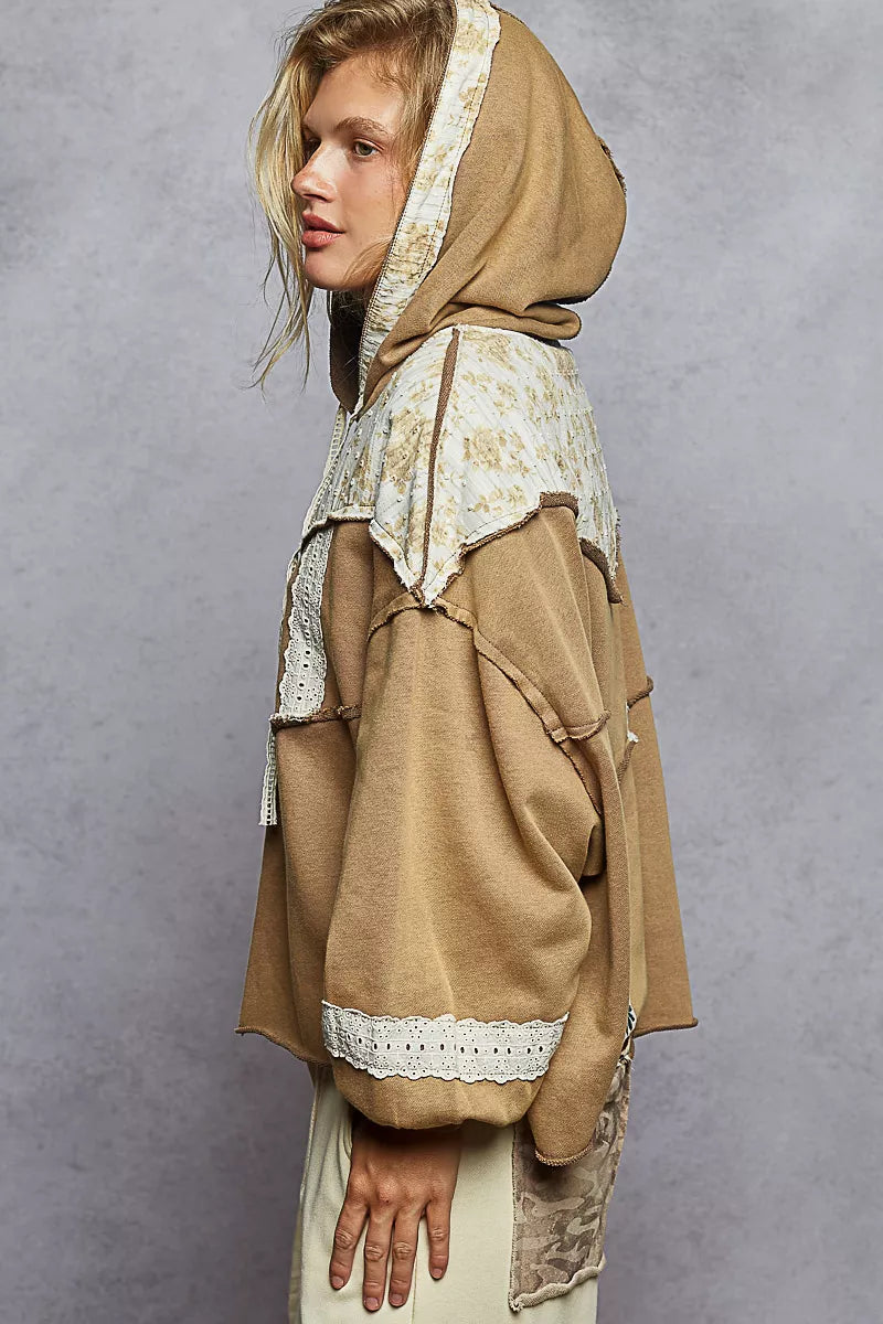 Vintage-washed tan hoodie with patchwork floral accents, lace trim, and balloon sleeves.