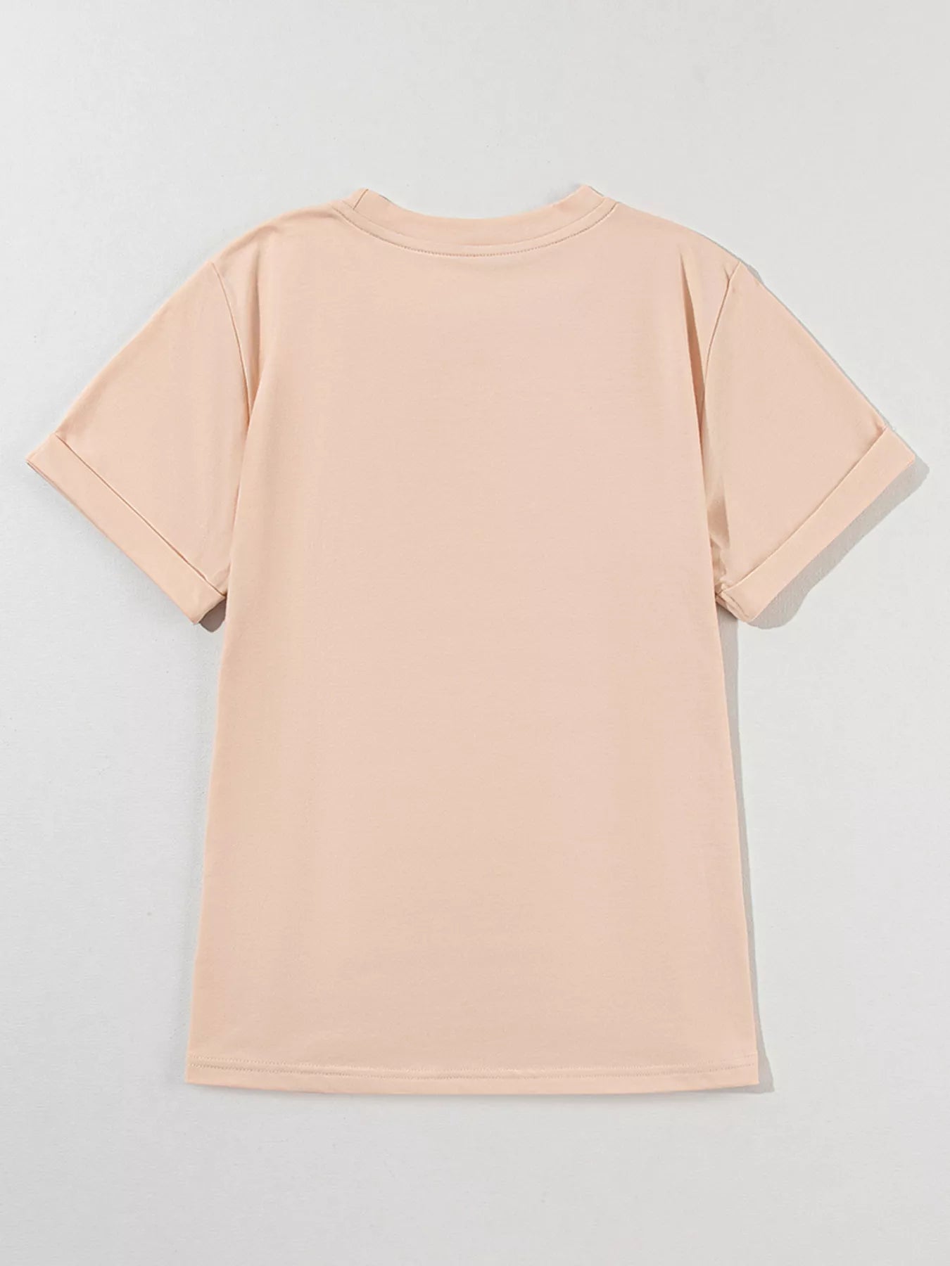 Woman wearing tan Duckie Sparkle Tee with sequin duck designs, fun quirky casual top for animal lovers.