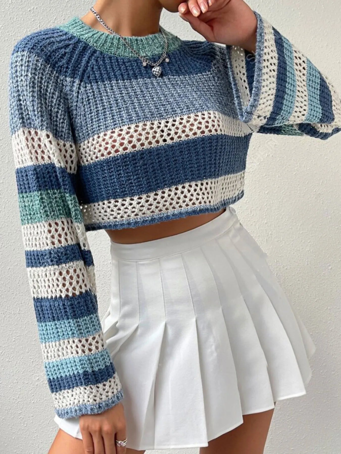 Dusty Horizon Crop Sweater – openwork striped color block knit in dusty blue with flared sleeves.