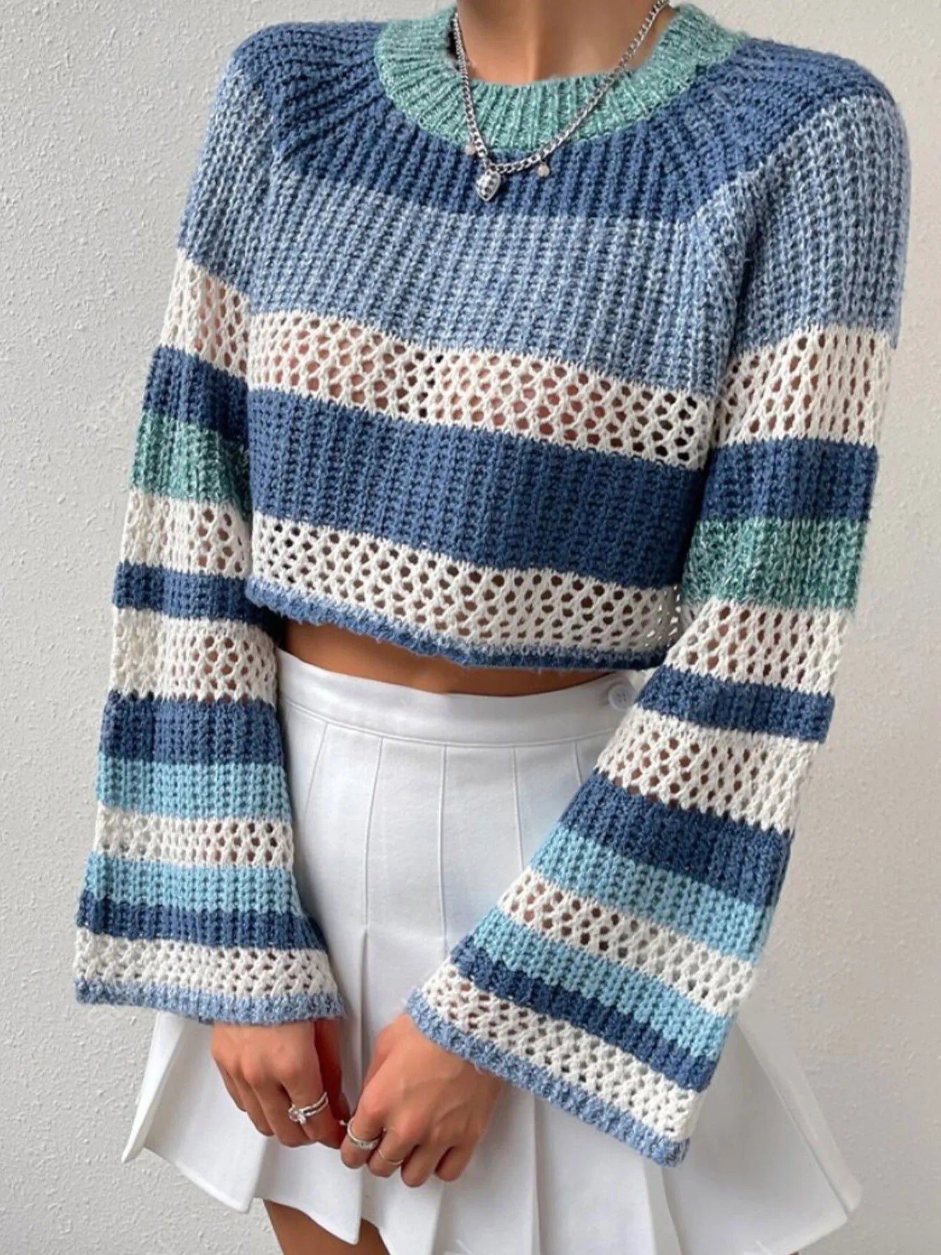 Dusty Horizon Crop Sweater – openwork striped color block knit in dusty blue with flared sleeves.