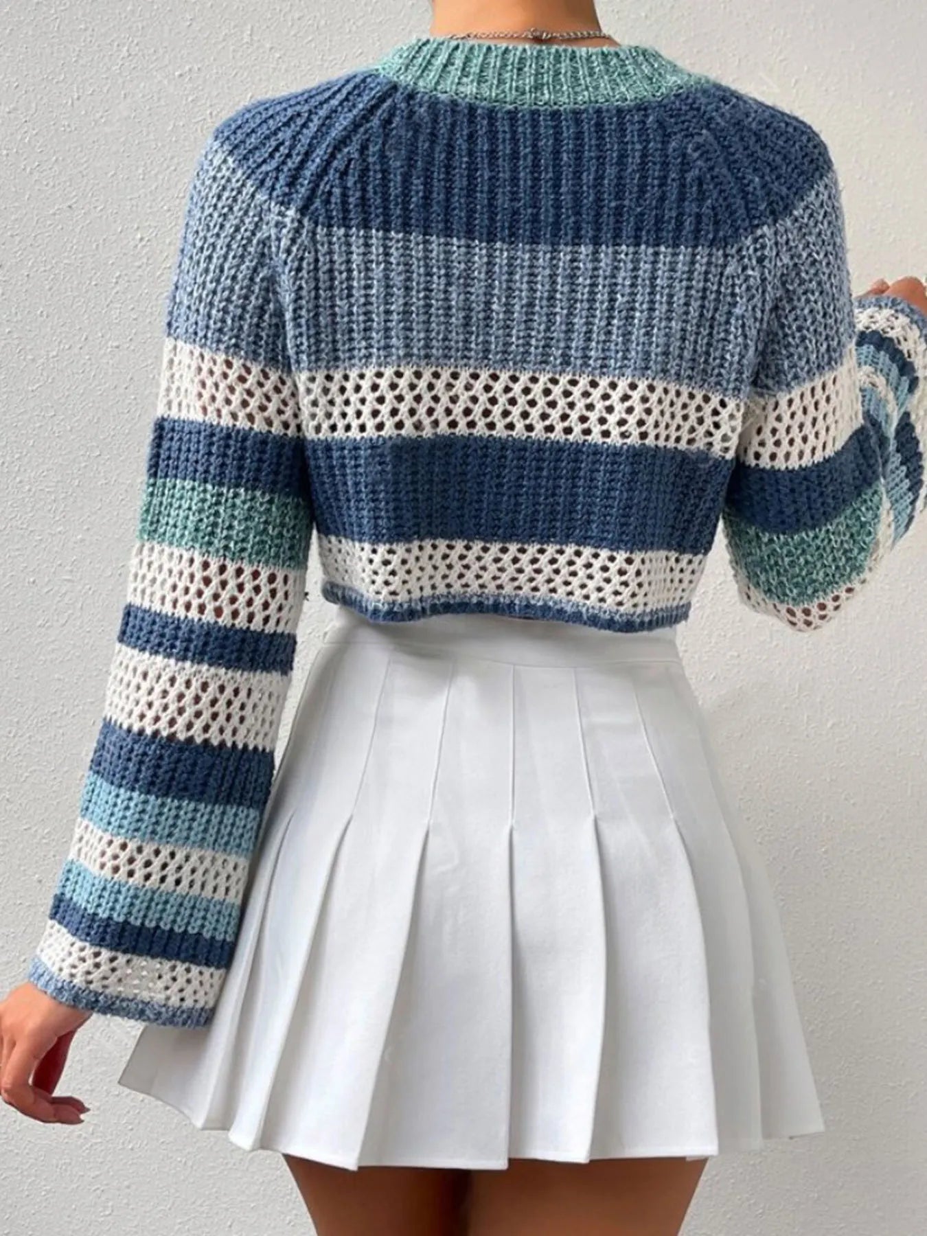 Dusty Horizon Crop Sweater – openwork striped color block knit in dusty blue with flared sleeves.