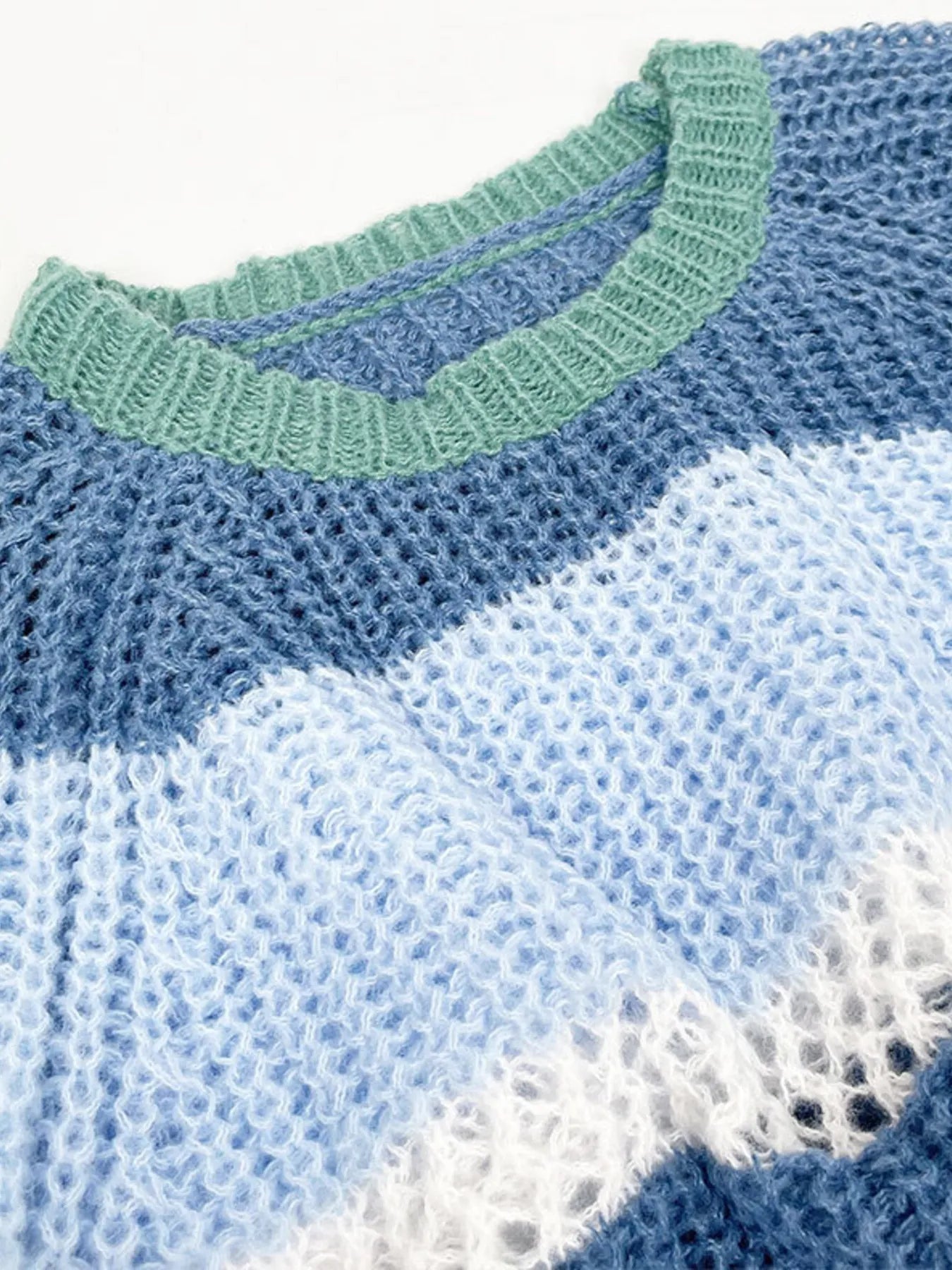 Dusty Horizon Crop Sweater – openwork striped color block knit in dusty blue with flared sleeves.