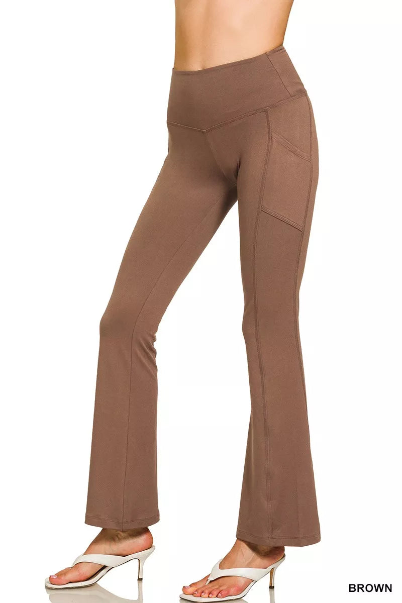 Brown high-rise microfiber flare pants with side pockets shown on model.