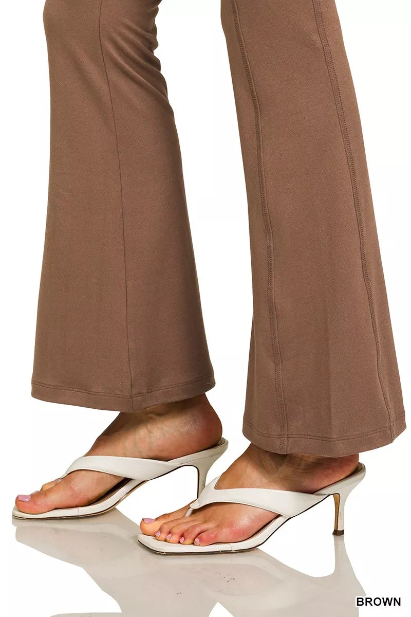 Brown high-rise microfiber flare pants with side pockets shown on model.