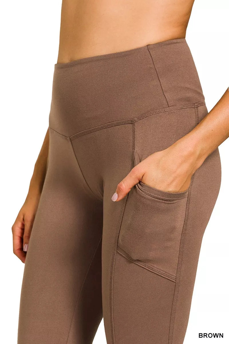 Brown high-rise microfiber flare pants with side pockets shown on model.