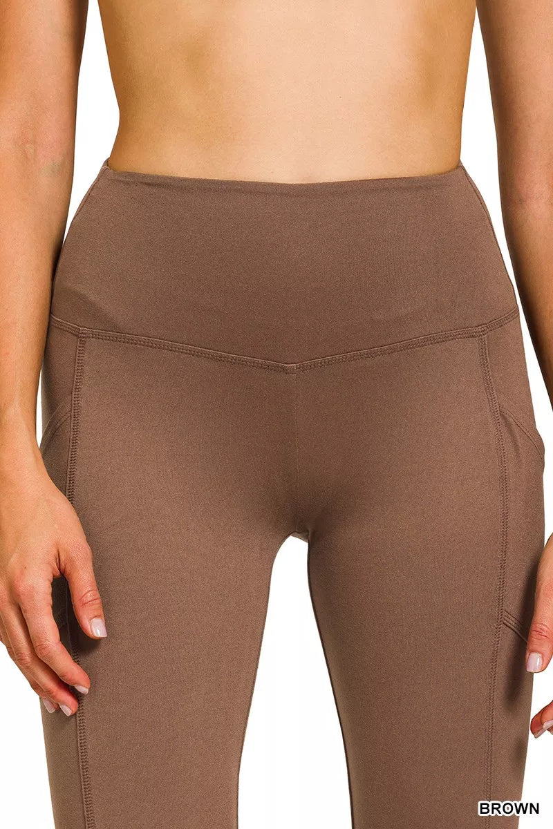 Brown high-rise microfiber flare pants with side pockets shown on model.