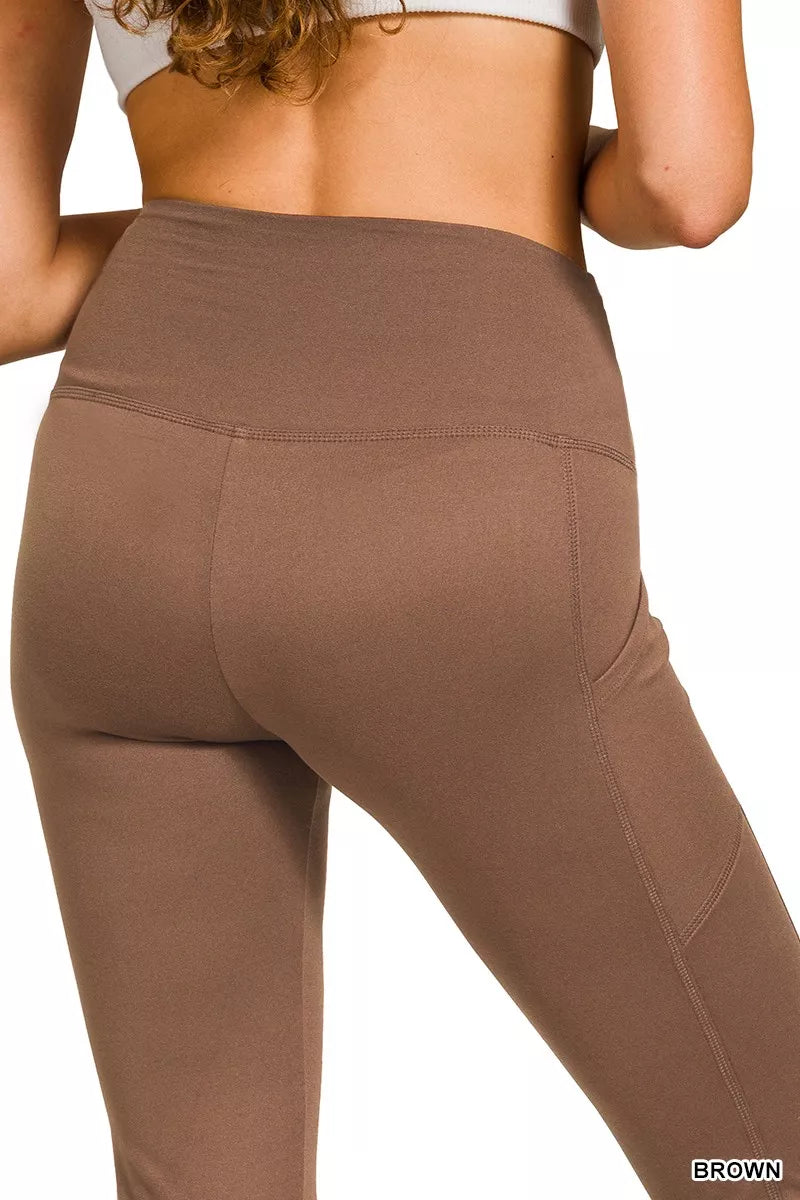 Brown high-rise microfiber flare pants with side pockets shown on model.