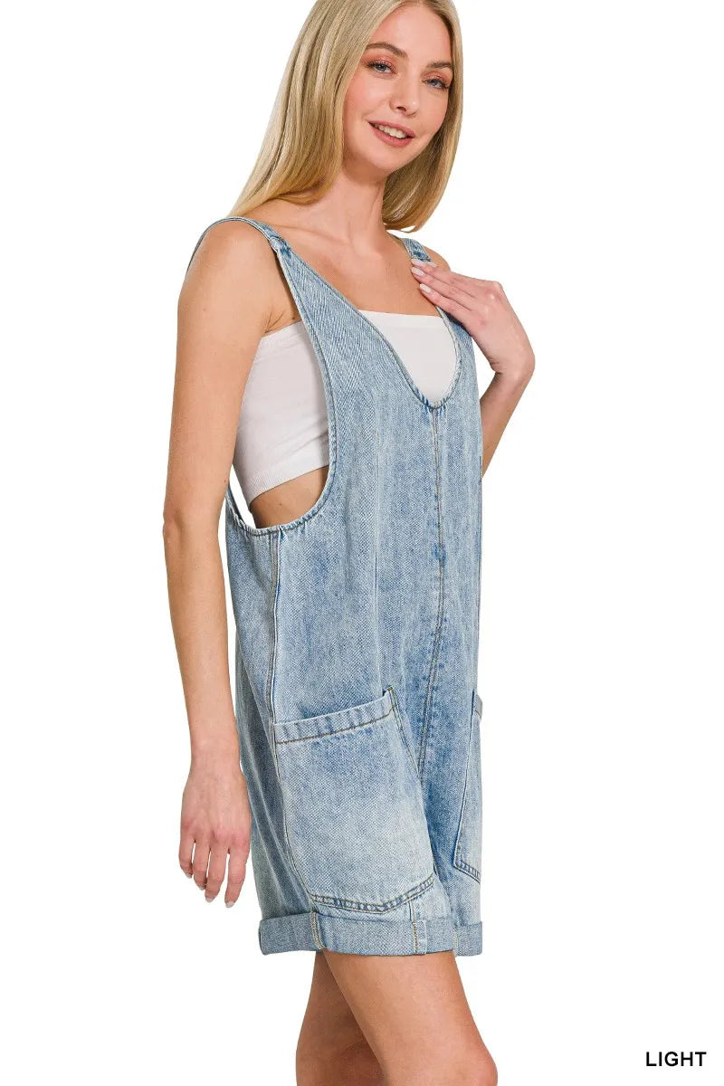 Light wash denim short overalls with front pockets and adjustable straps