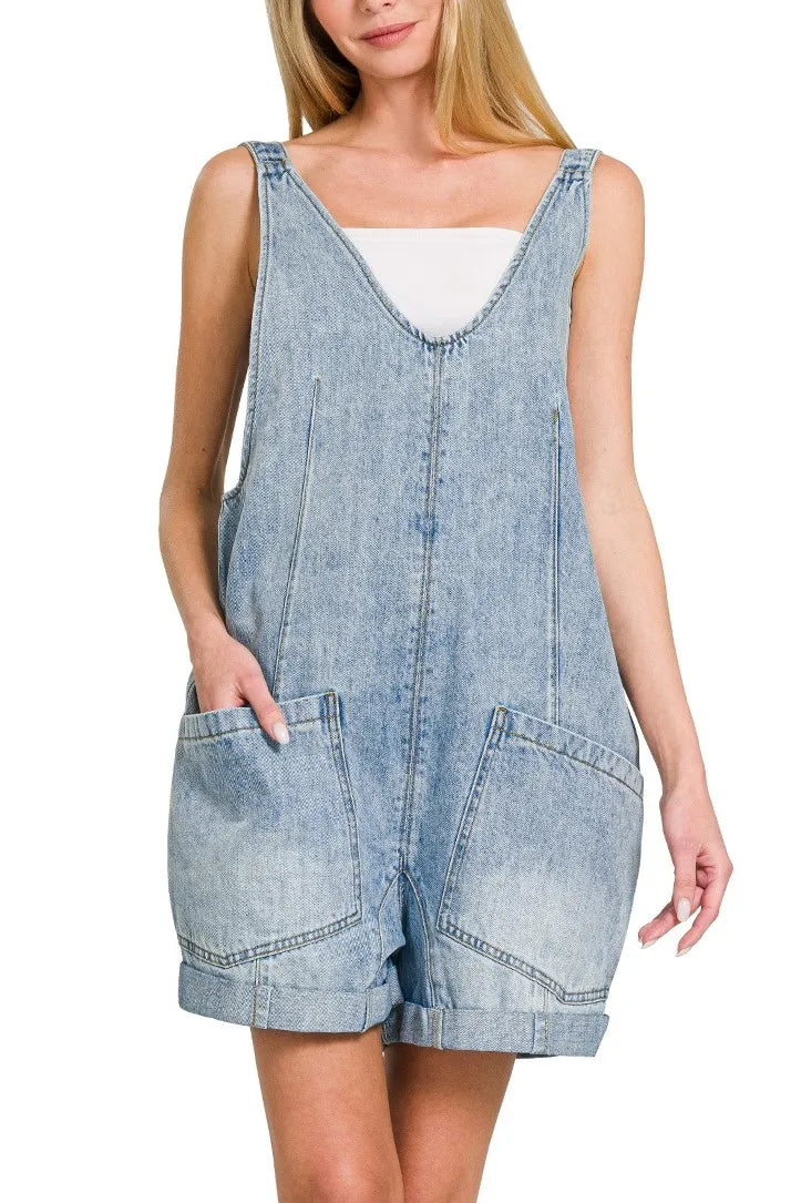 Light wash denim short overalls with front pockets and adjustable straps