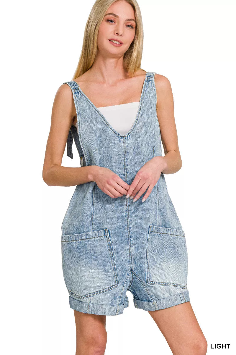 Light wash denim short overalls with front pockets and adjustable straps