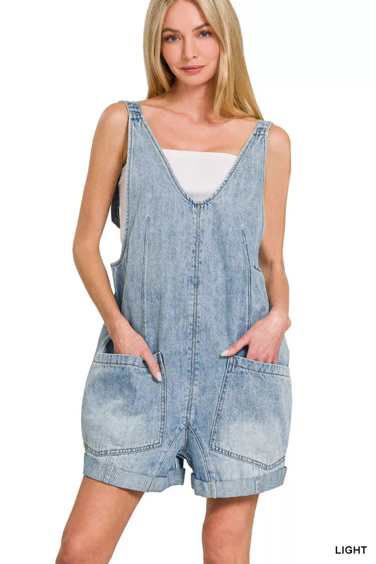 Light wash denim short overalls with front pockets and adjustable straps