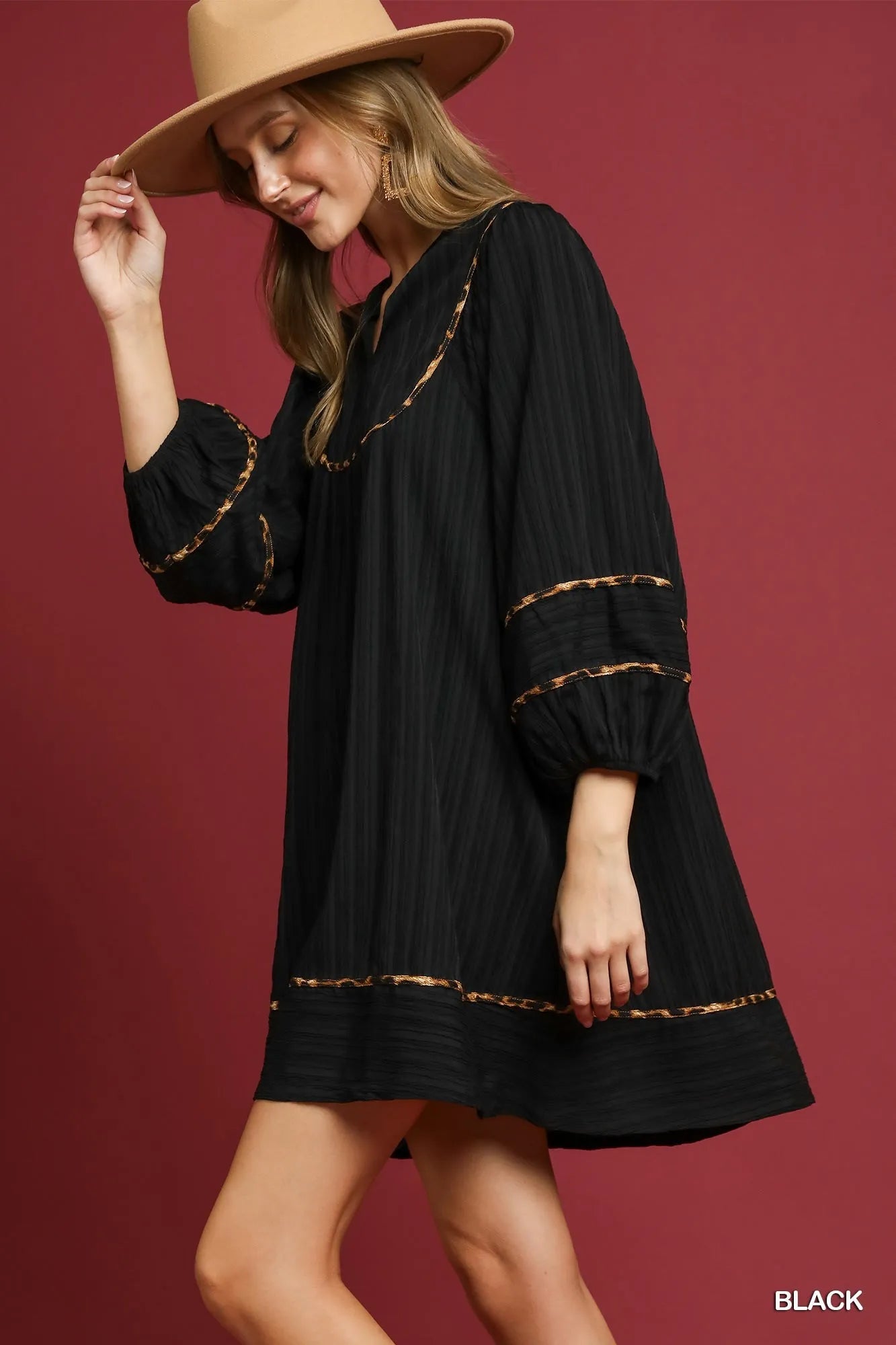 Black textured babydoll dress with leopard print trim – Eclipse style from A Whimsical Affair.