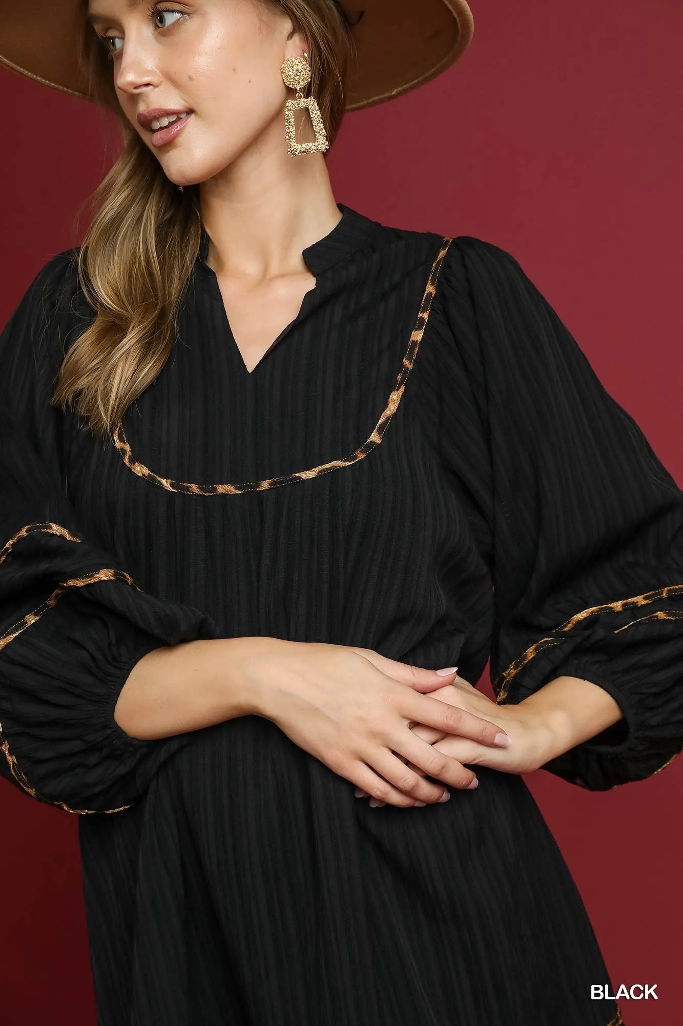 Black textured babydoll dress with leopard print trim – Eclipse style from A Whimsical Affair.