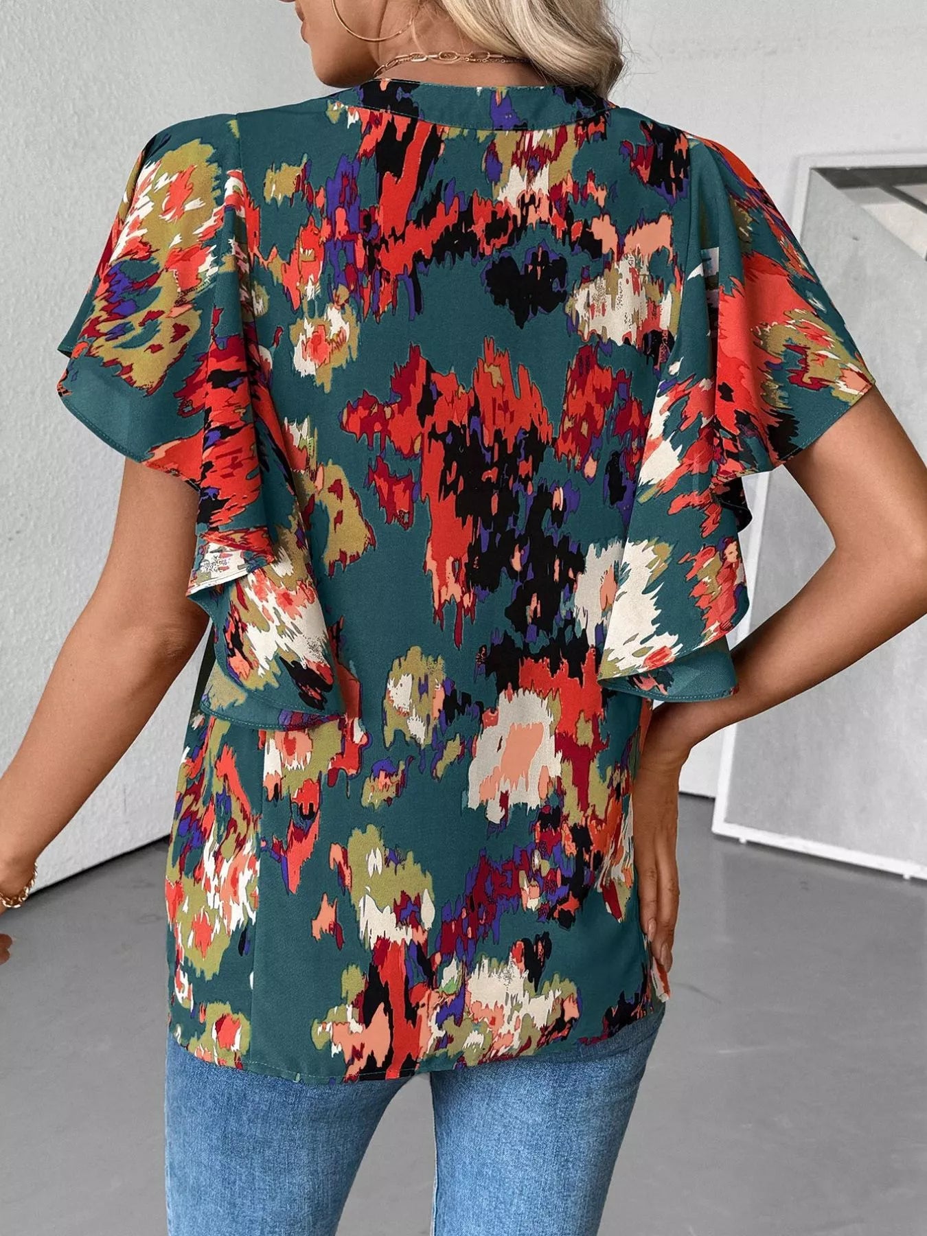 Multicolor abstract blouse with flutter sleeves and buttoned ruched neckline