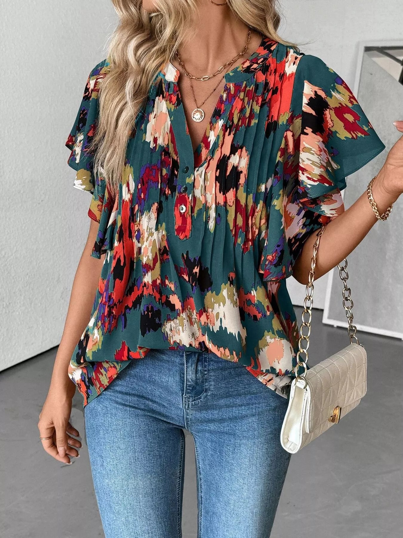 Multicolor abstract blouse with flutter sleeves and buttoned ruched neckline