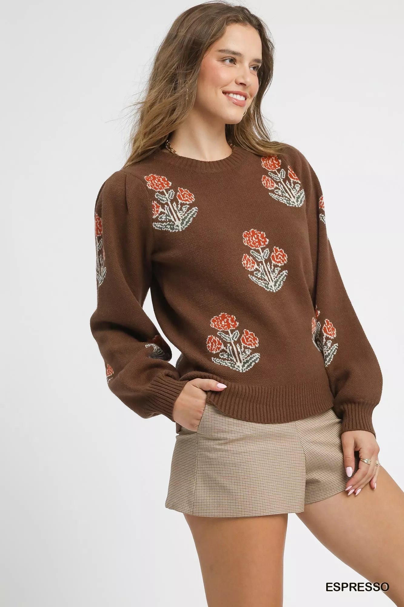 Woman wearing an espresso brown puff sleeve floral knit sweater — cozy feminine winter outfit from A Whimsical Affair.