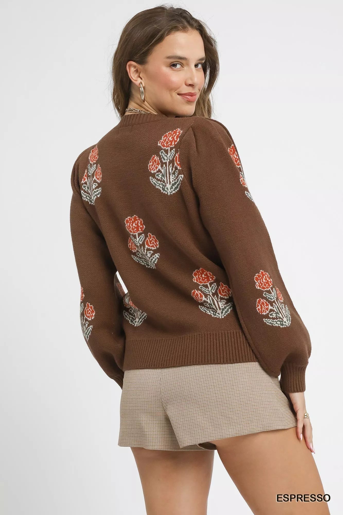 Woman wearing an espresso brown puff sleeve floral knit sweater — cozy feminine winter outfit from A Whimsical Affair.