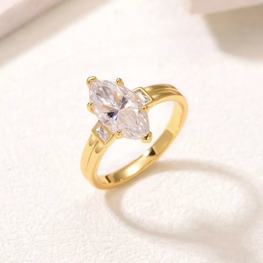 Close-up of a marquise-cut moissanite ring with 18K gold-plated band and zircon accents – elegant fine jewelry from A Whimsical Affair.