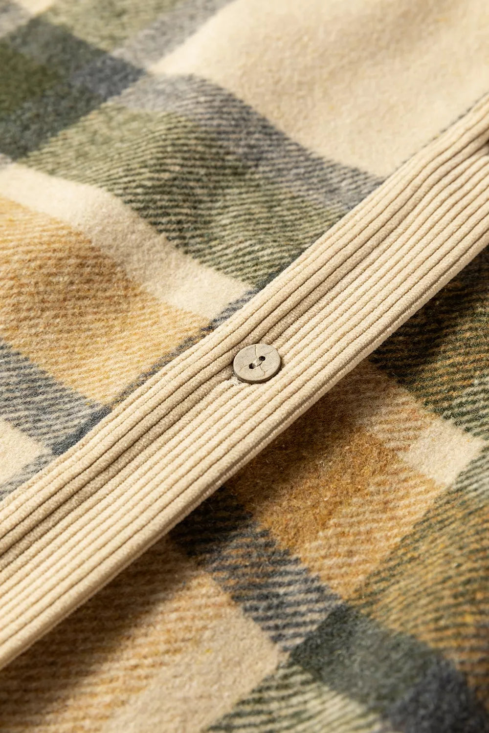 Plaid and corduroy button-front shacket with pockets, relaxed fit, normal thickness, and cozy earthy everyday styling.