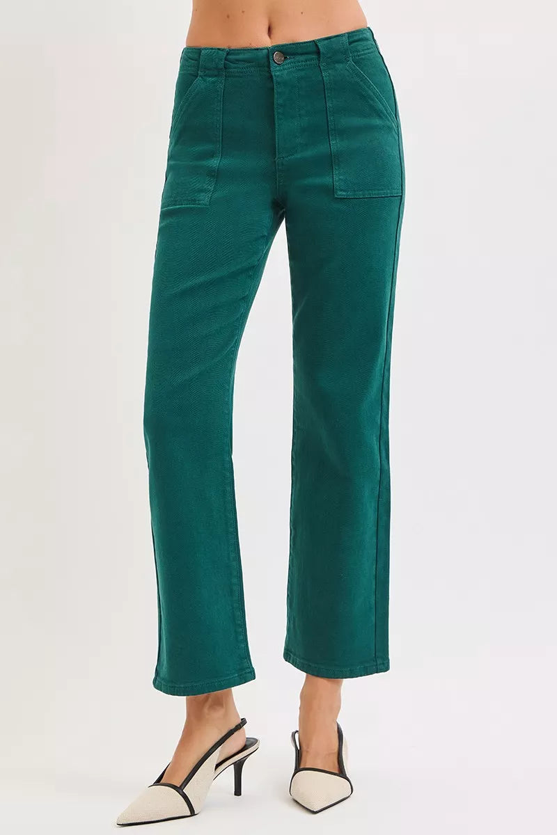 Woman wearing emerald green high-rise corduroy pants with patch pockets and ankle-flare fit — winter chic look from A Whimsical Affair.