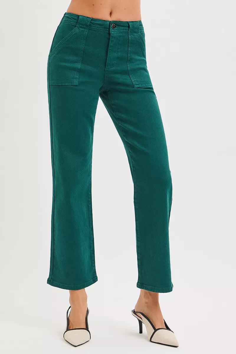Woman wearing emerald green high-rise corduroy pants with patch pockets and ankle-flare fit — winter chic look from A Whimsical Affair.